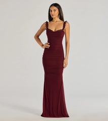 Turn heads at Prom 2025 in this burgundy prom dress, where statement-making details meet the iconic style of the Morgana Lace-Up Ruched Mermaid Dress .