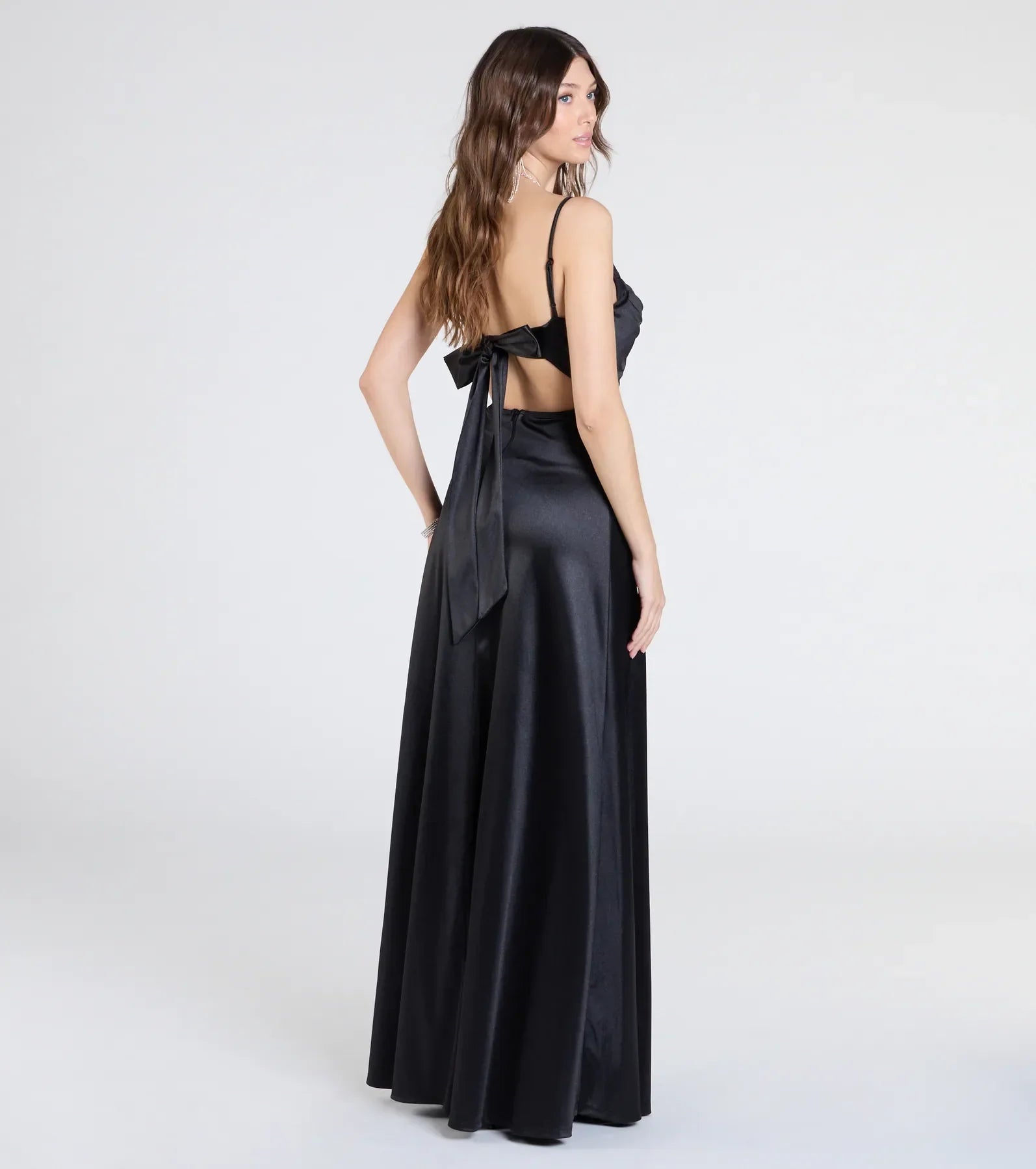 The Steffanie Tie Back Slit A-Line Satin Formal Dress is a show-stopping black prom dress, offering a sleek, slimming silhouette that enhances your natural beauty for an unforgettable night.