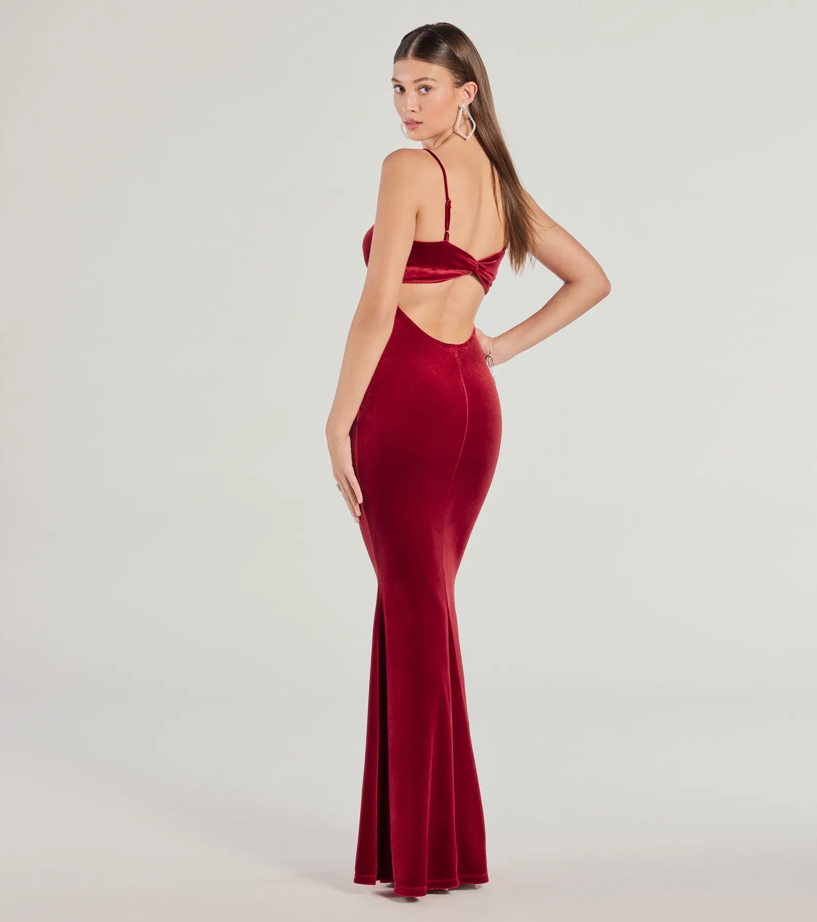 Make a statement in the Katie Open Back Mermaid Velvet Formal Dress, a bold red prom dress designed to exude confidence, elegance, and a striking prom-night look.