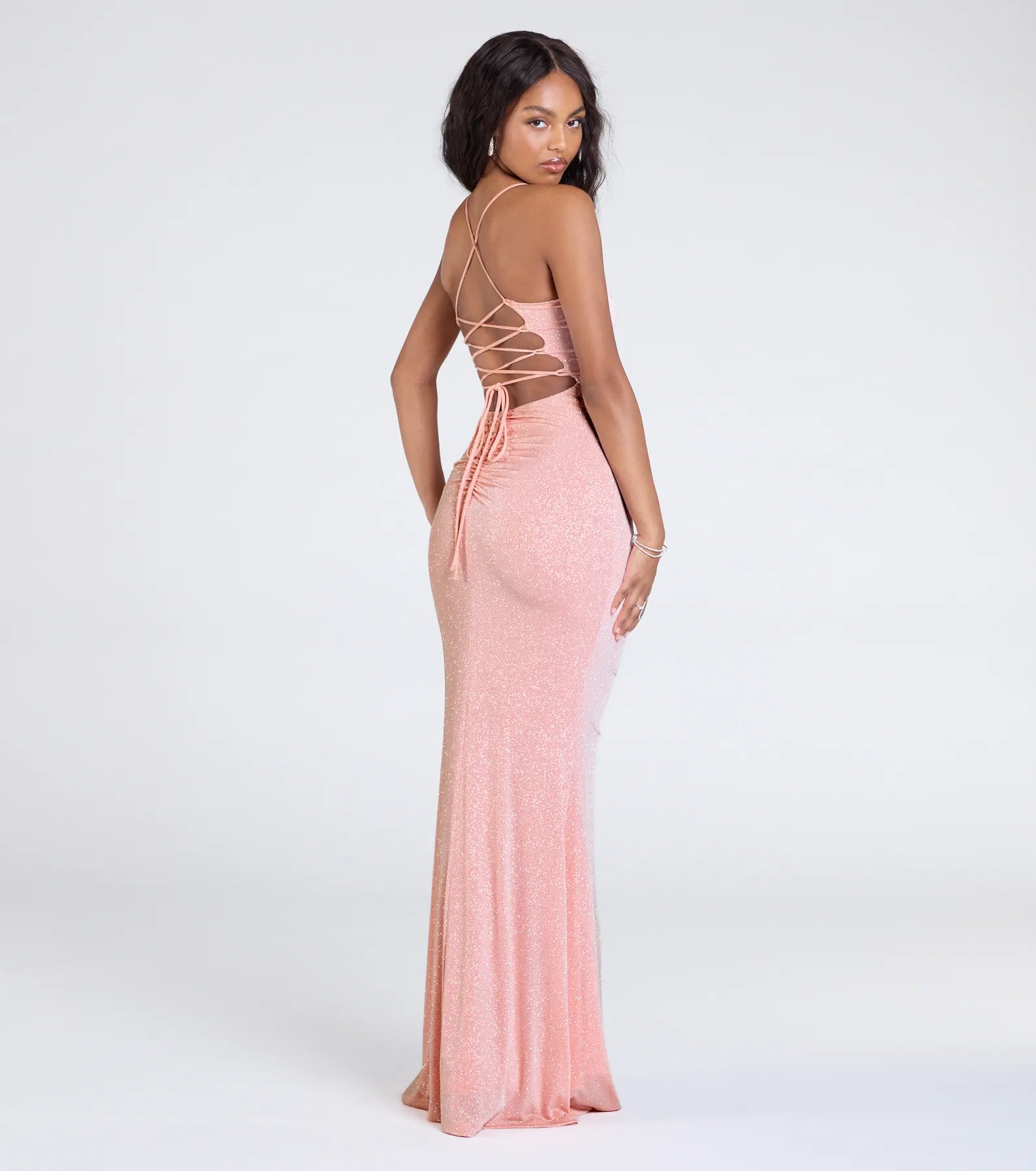 Make a bold statement in the Diane Lace-Up Slit Mermaid Glitter Formal Dress in peach, the perfect fall dress for weddings, cocktail hours, nights out, and/or seasonal celebrations.