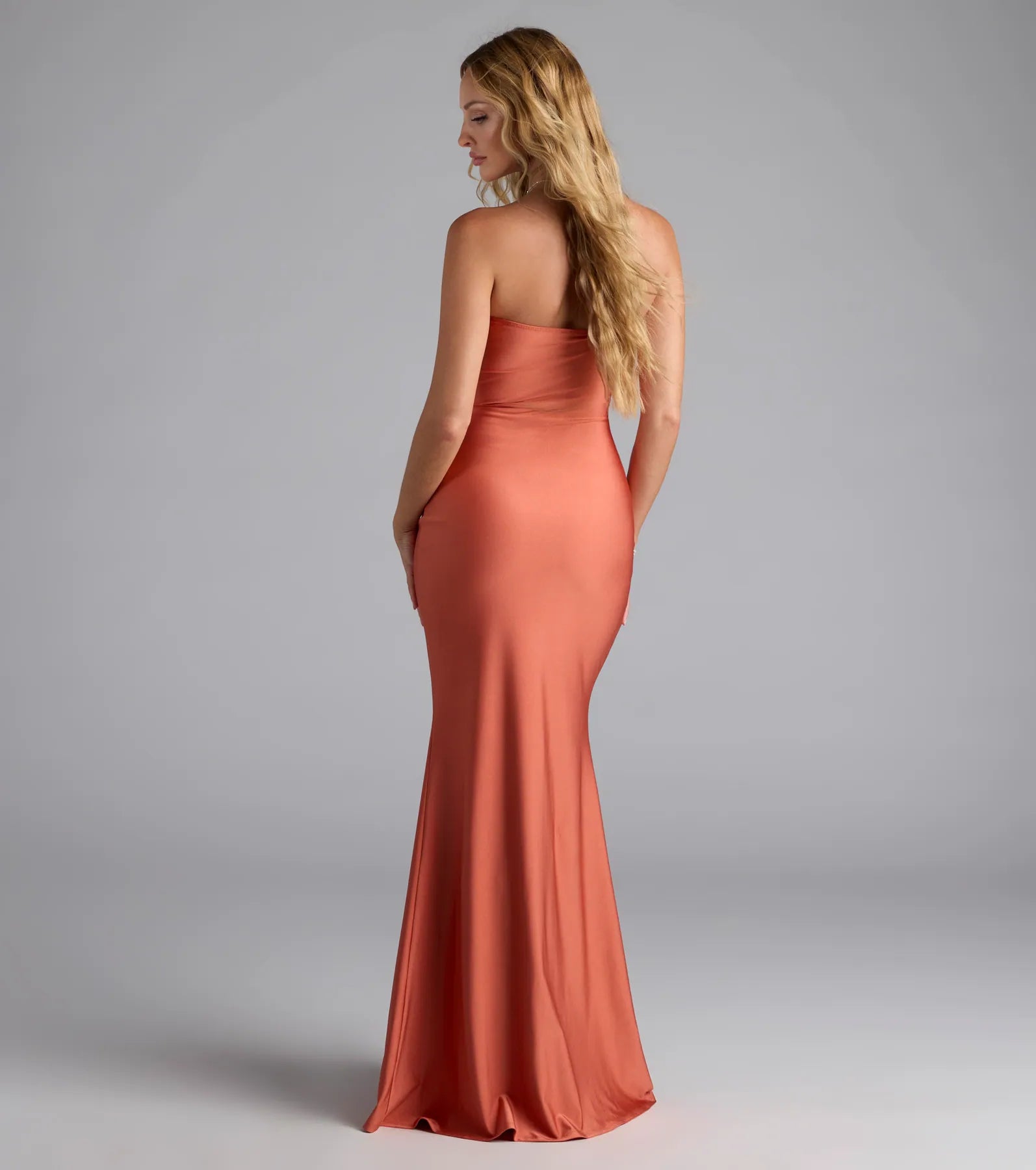 Own the spotlight in the Cheryl Strapless Slit Mermaid Formal Dress, a rust formal dress crafted to deliver luxe style for autumn weddings, Military Balls, or any special event.