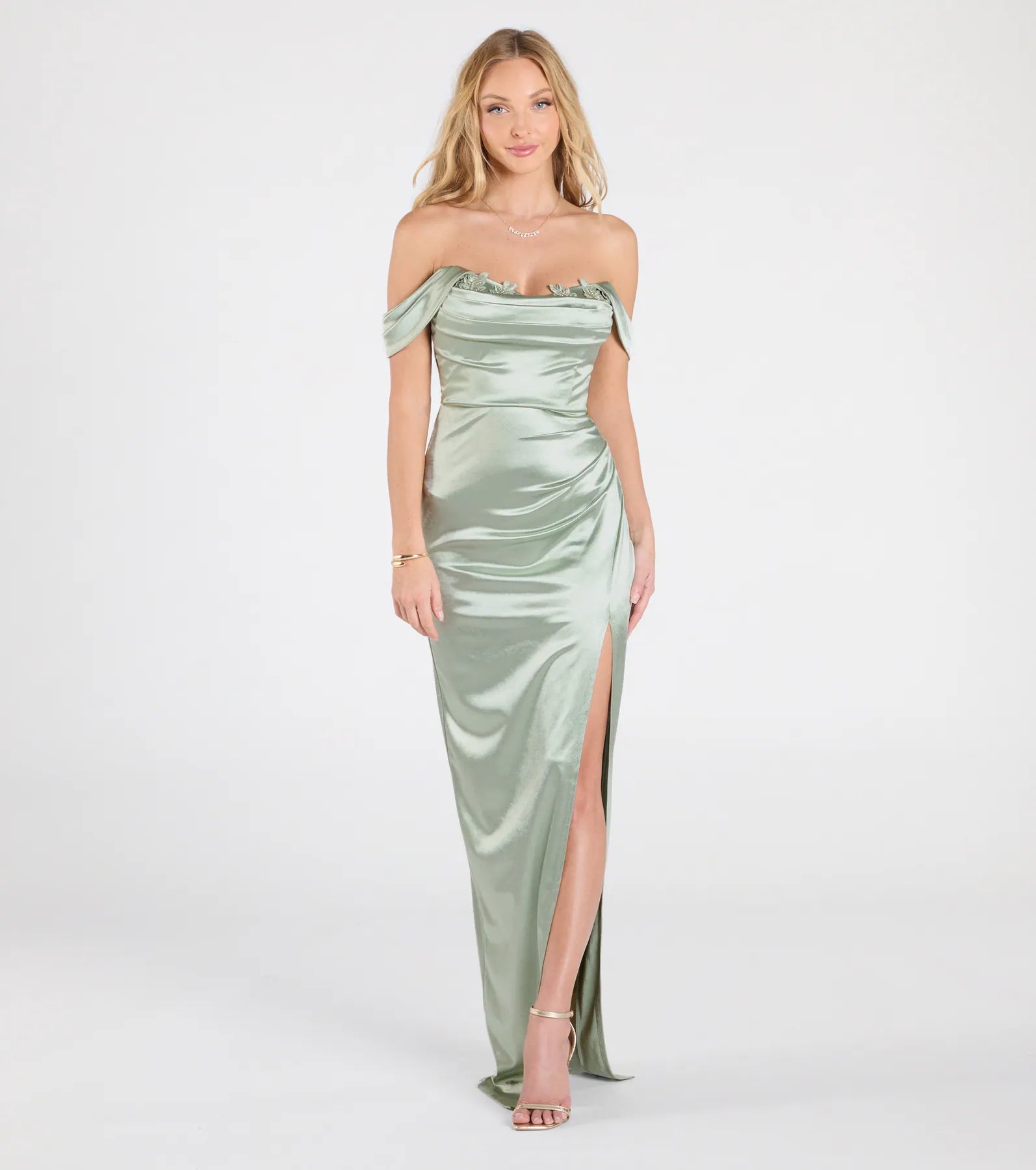 Feel instantly put-together in the Phoebe Off-The-Shoulder Lace-Up Satin Formal Dress in sage green, a stylish wedding guest dress designed for confident style and all-out celebration.