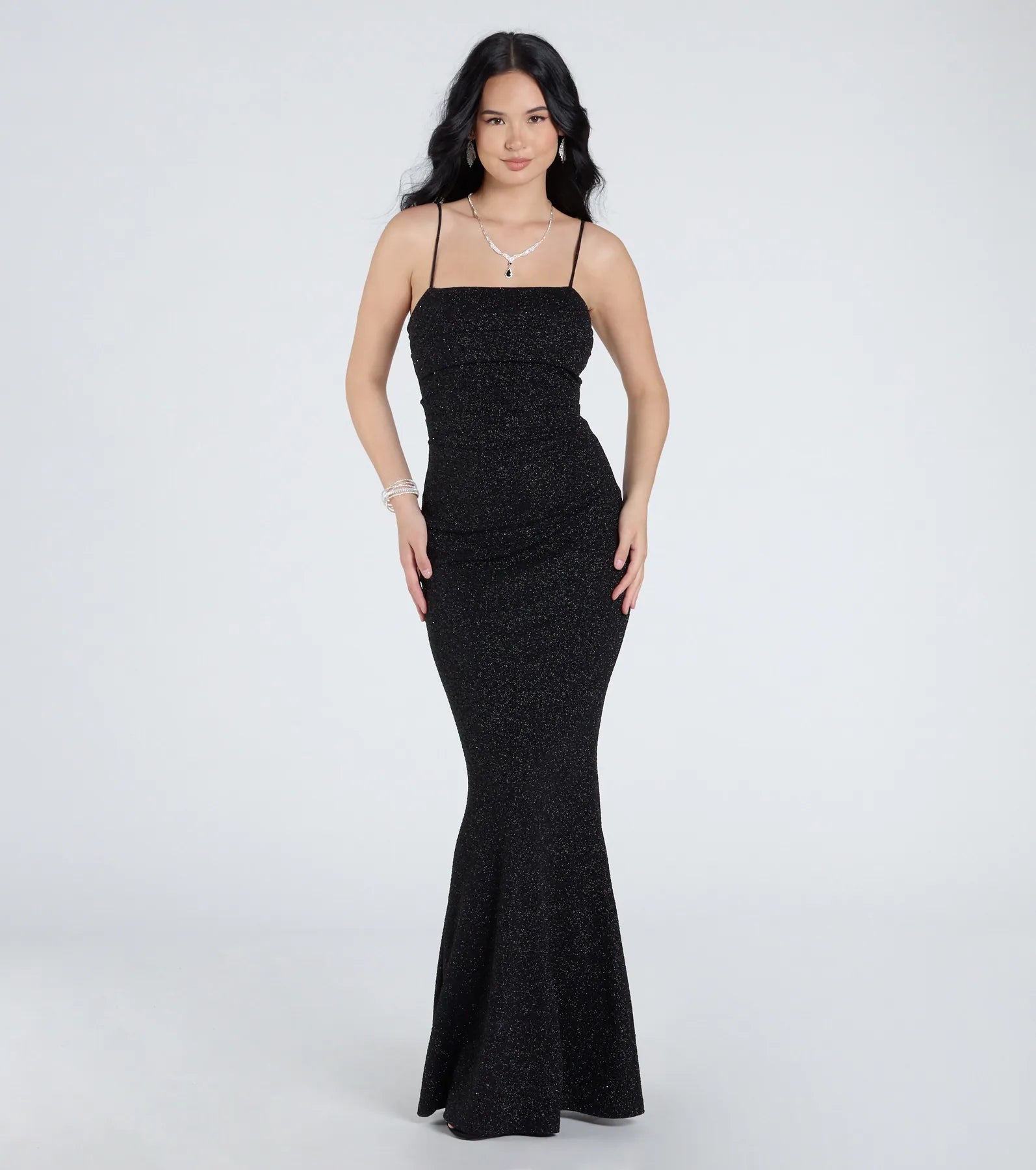 Keep it classic with the Wendy Sleeveless Mermaid Glitter Formal Dress, a feed-worthy pick from Windsor's black homecoming dress collection made to stop their scroll from pictures to the dance floor.