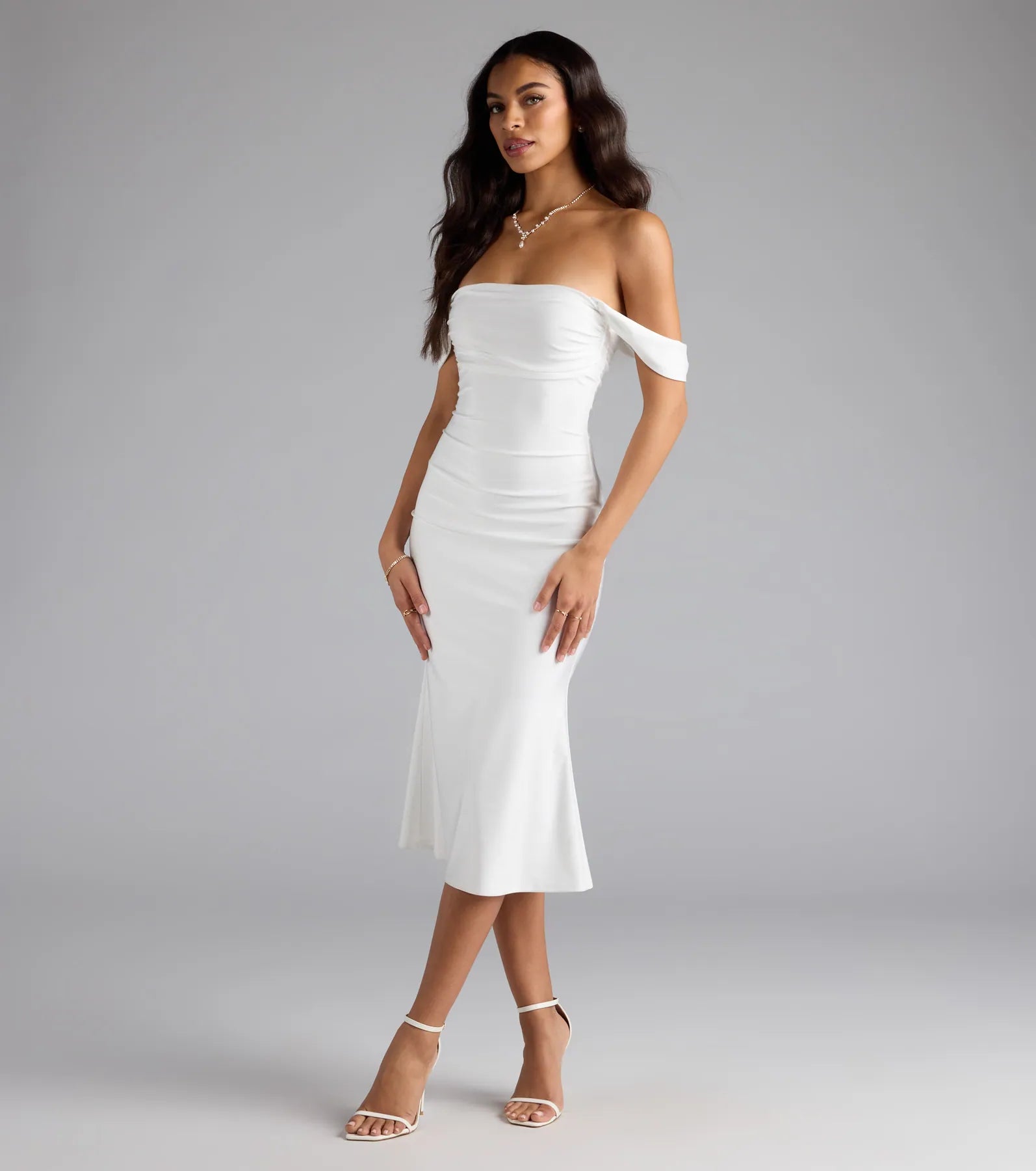 The Exceptional Off-The-Shoulder Flared Midi Dress in white features a flattering fit and mid-calf hem, redefining effortless midi dresses for any occasion.
