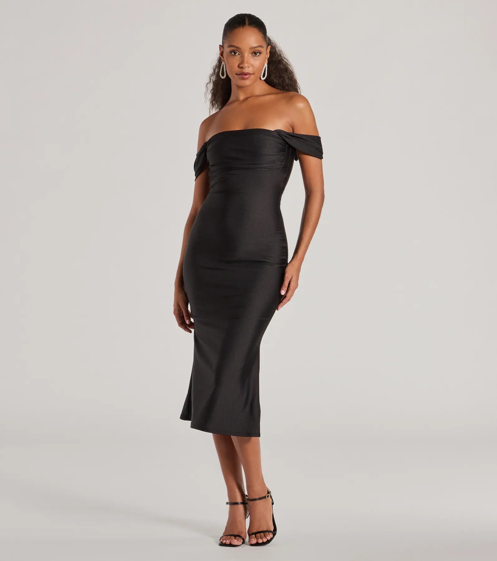 The Exceptional Off-The-Shoulder Flared Midi Dress is your new go-to black dress—effortless, versatile, and made to update your fall style in seconds.