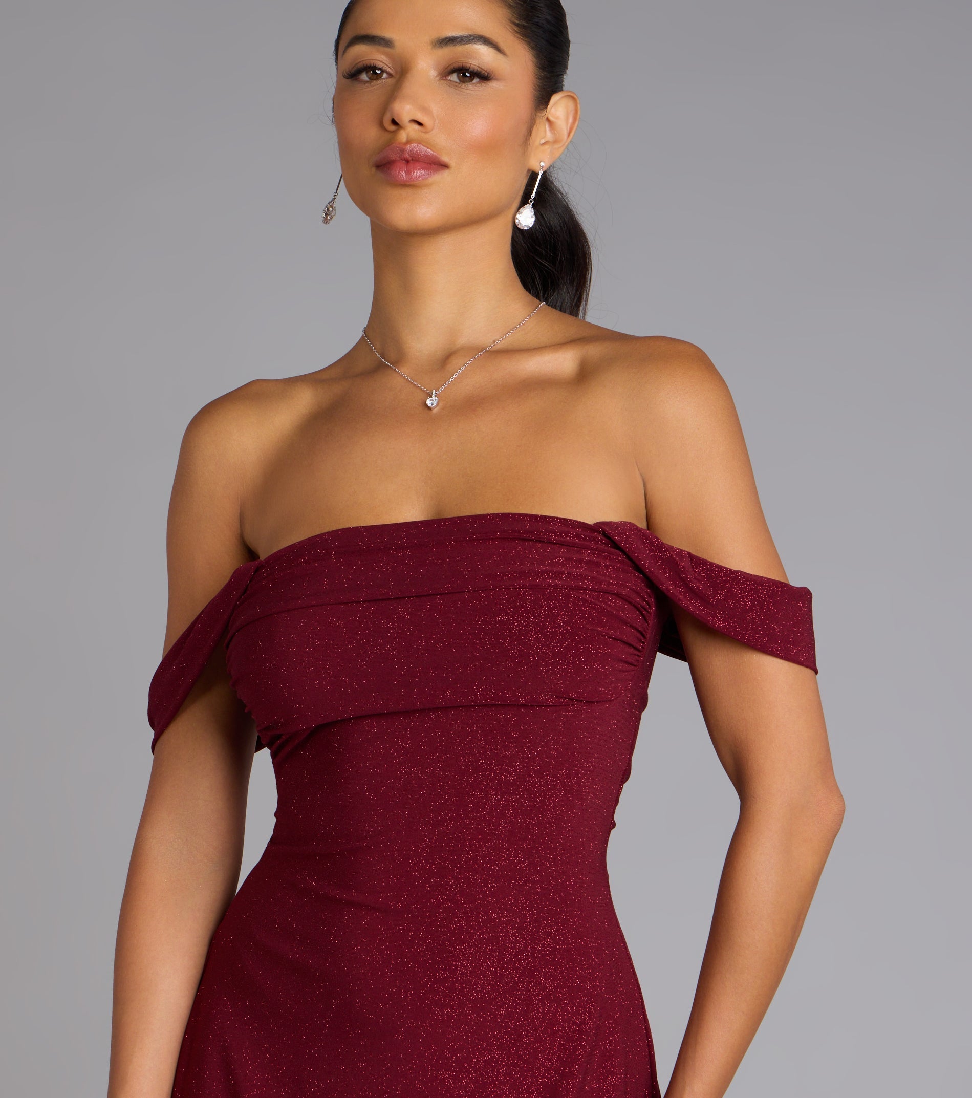 The Classic Glitz Glitter Knit Off-The-Shoulder Mini Dress is your new go-to Windsor dress—effortless, versatile, and made to update your fall style in seconds.