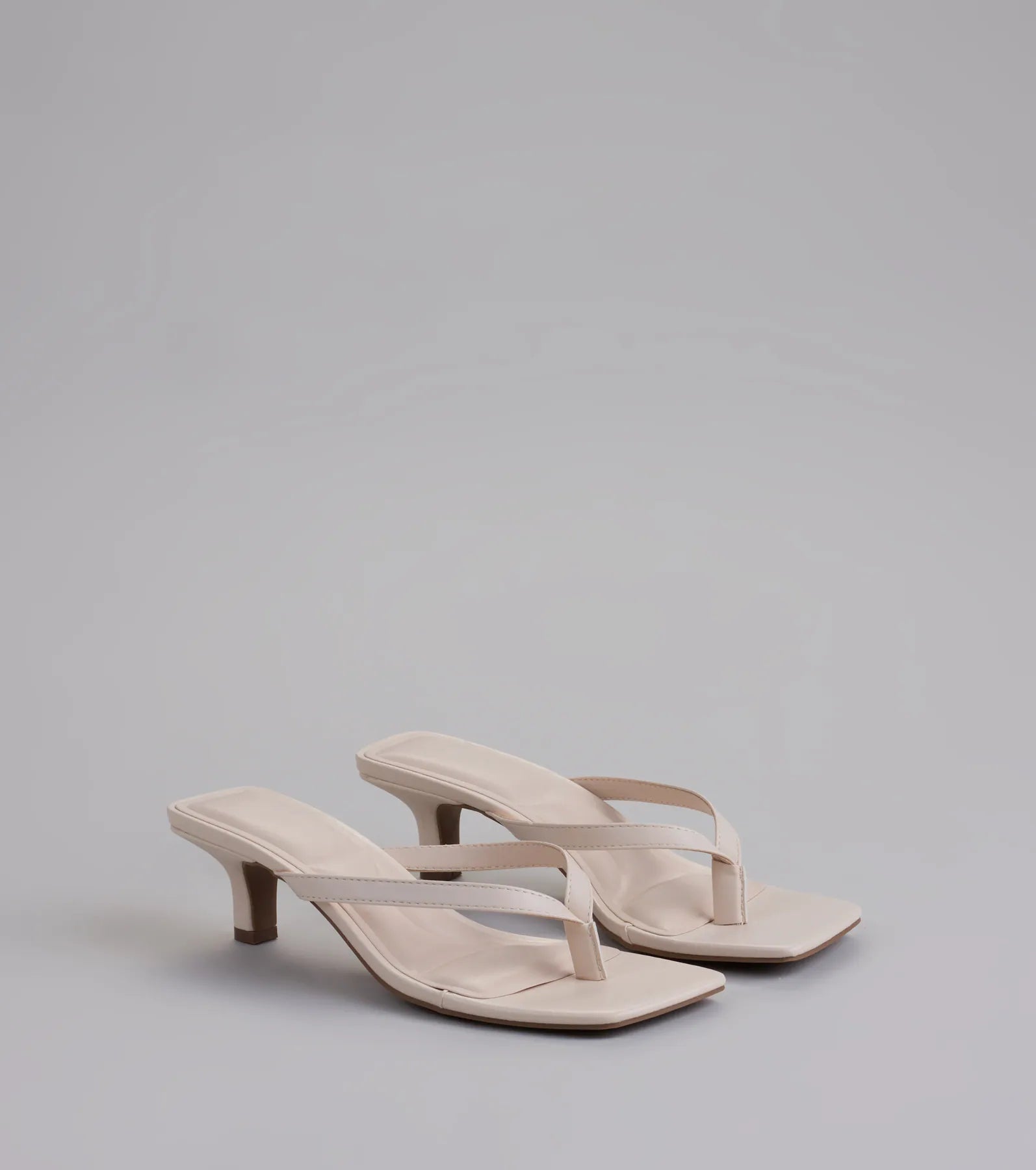 Style made simple with the Feeling Chic Thong Square Toe Heels in ivory, trendy women’s shoes that take your outfit from basic to bold in one step.