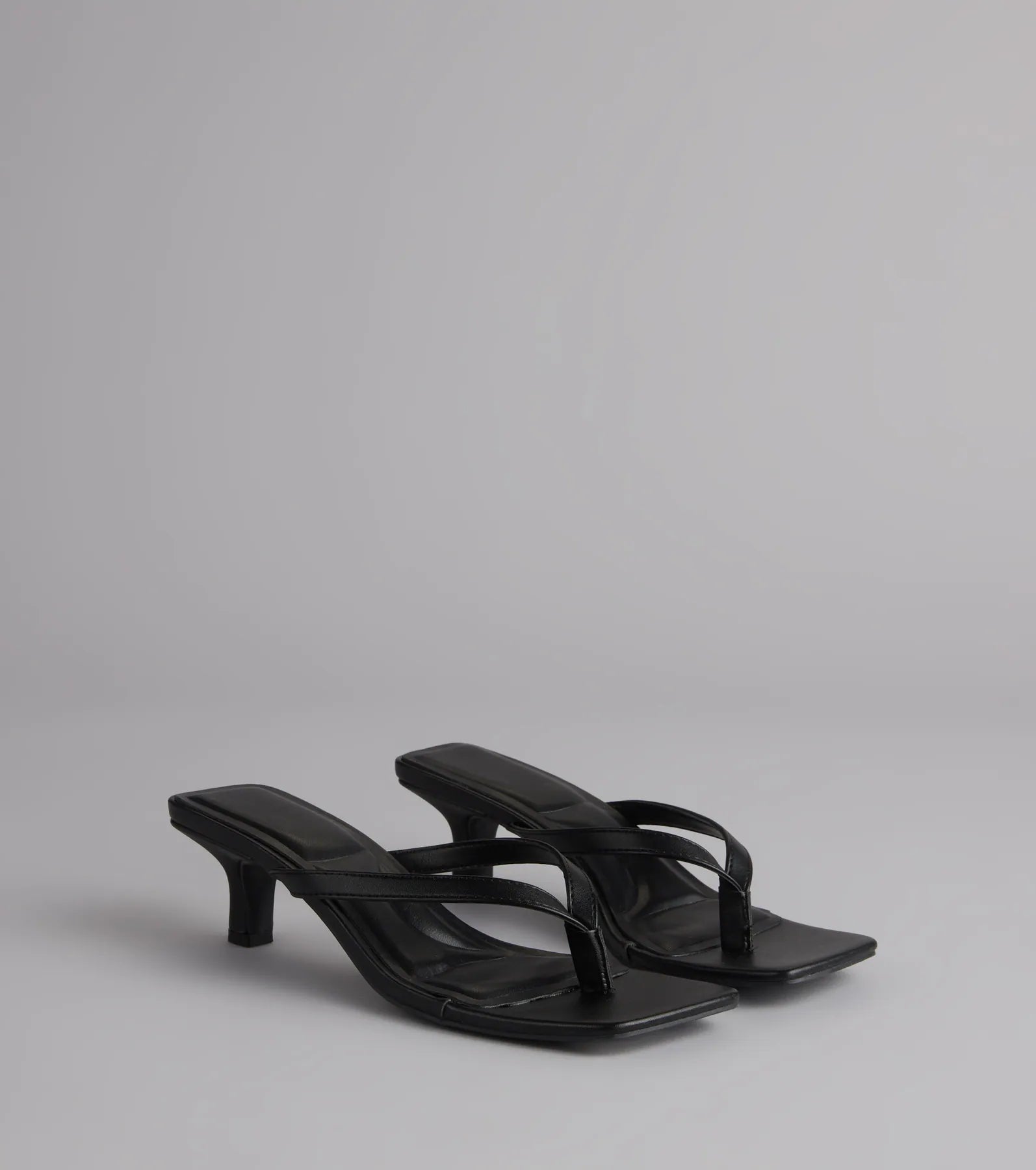 Style made simple with the Feeling Chic Thong Square Toe Heels in black, trendy women’s shoes that take your outfit from basic to bold in one step.