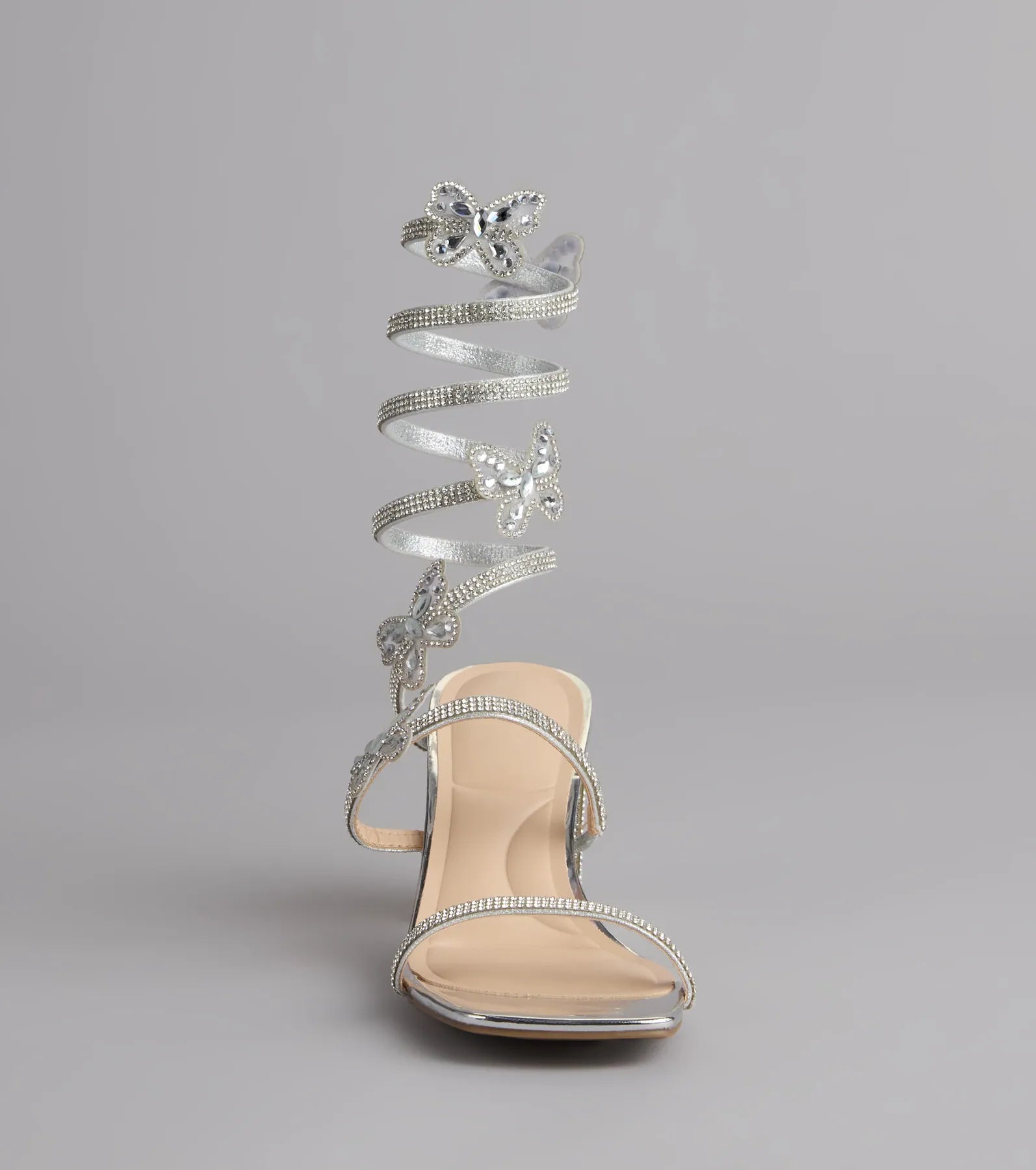 Style made simple with the Flutter Up Rhinestone Spiral Strap Heels in silver, trendy women’s shoes that take your outfit from basic to bold in one step.