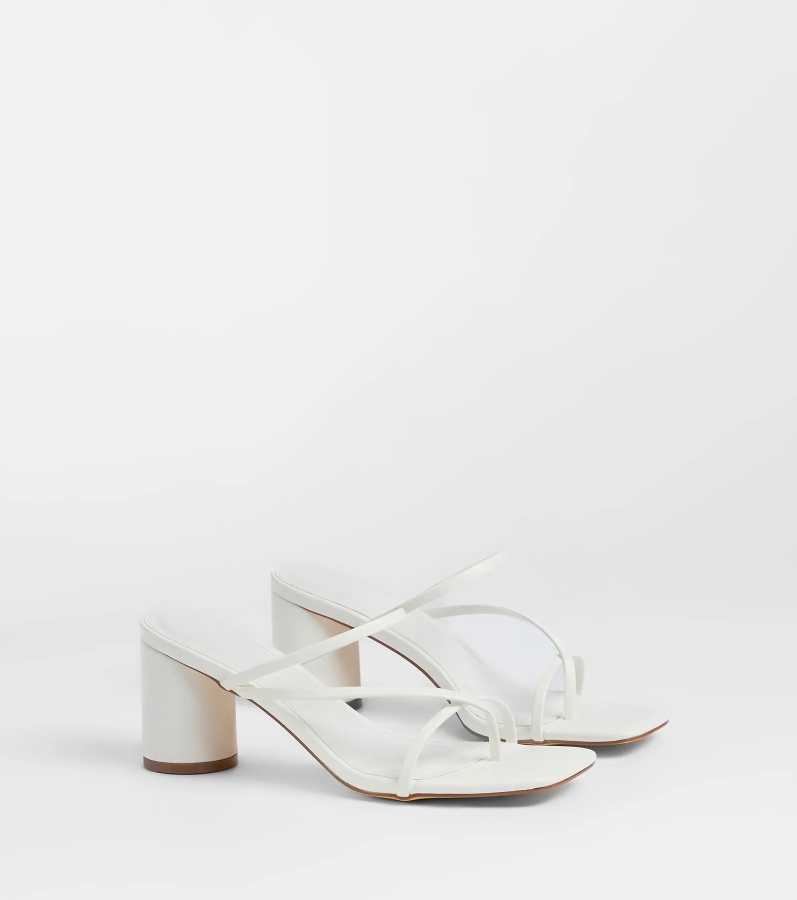 Style made simple with the So Much Personality Strappy Block Heels in white, trendy women’s shoes that take your outfit from basic to bold in one step.