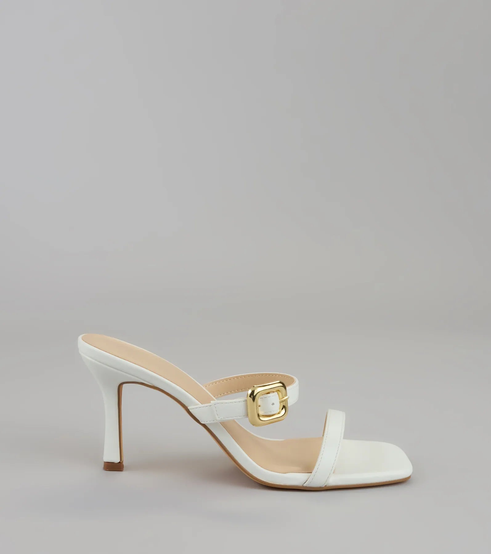 Style made simple with the Booked and Buckled Mule Heels in white, trendy women’s shoes that take your outfit from basic to bold in one step.