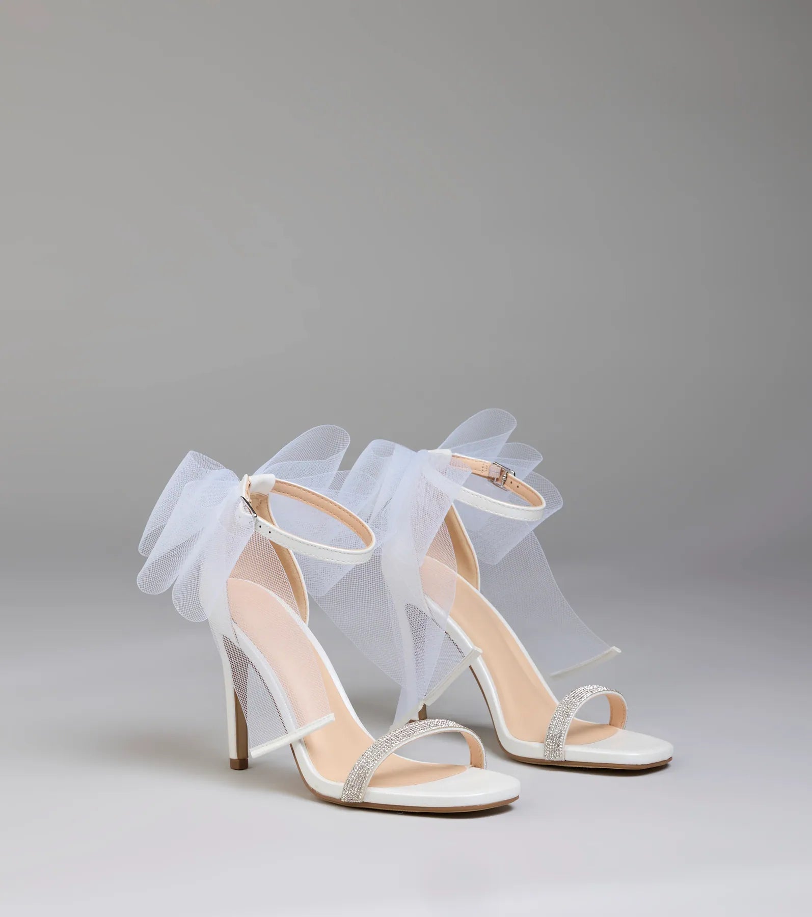 Style made simple with the Tied With A Bow Stiletto Heels in white, trendy women’s shoes that take your outfit from basic to bold in one step.