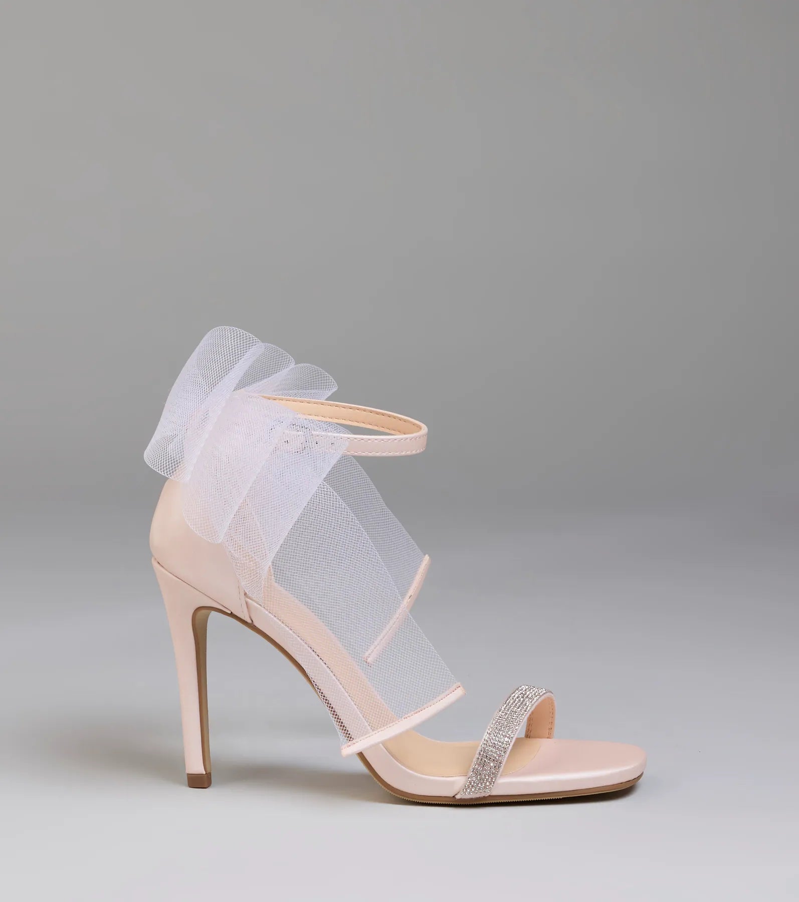 Elevate warm-weather looks with Tied With A Bow Stiletto Heels in pink, a pair of trendy sandals bringing chic, modern flair to every step.