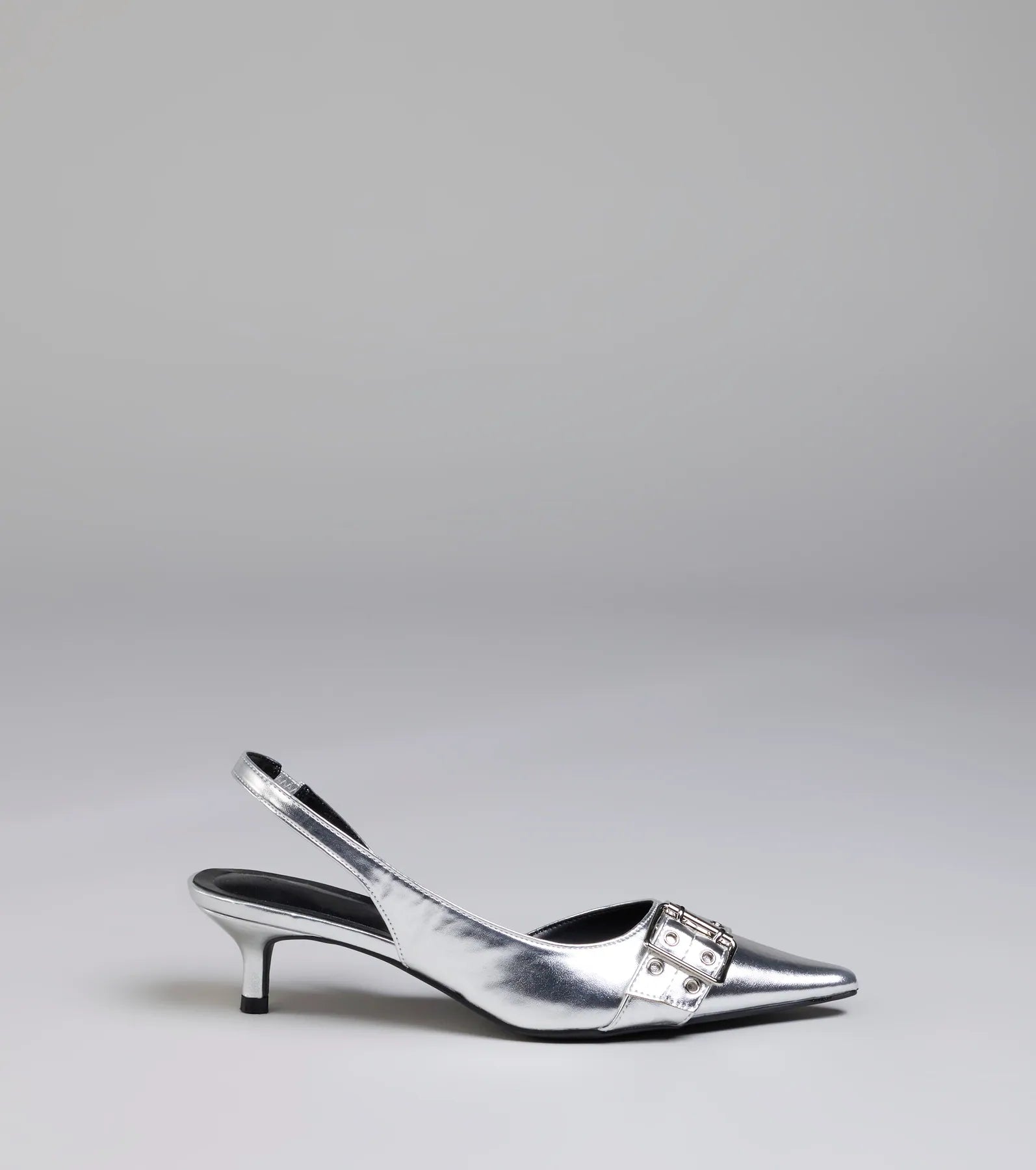 Turn heads in the Sleek Trendy Buckle Strap Slingback Kitten Heels, silver heels showcasing a fresh trend or stylish detail made to elevate your full Windsor fit.