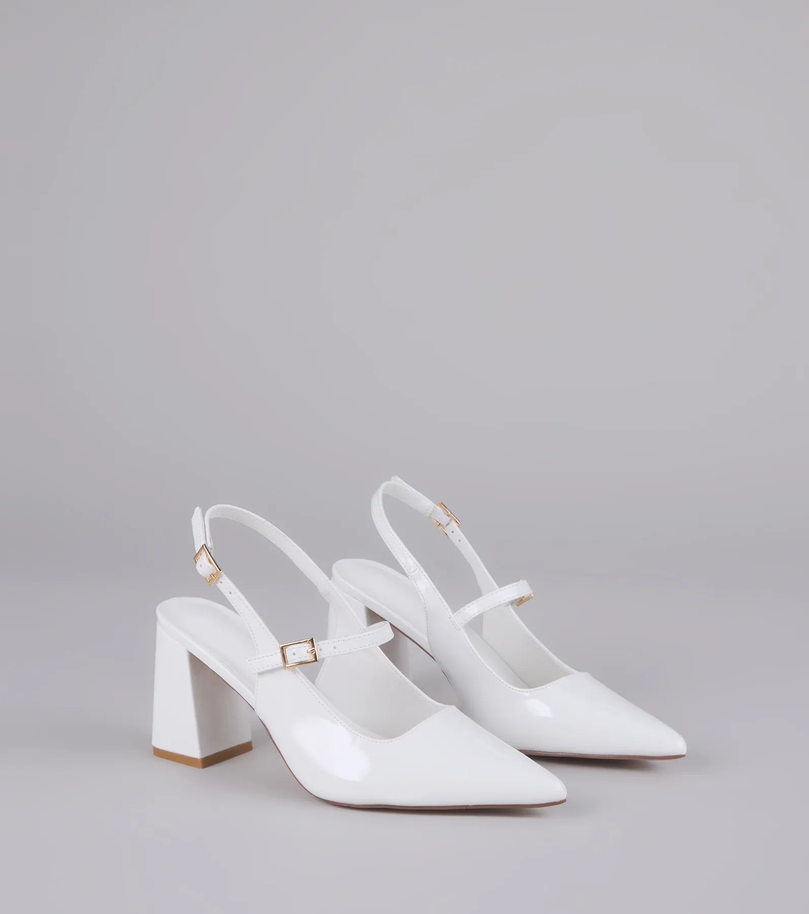 Style made simple with the Point Made Buckle Strap Sling-Back Pumps in white, trendy women’s shoes that take your outfit from basic to bold in one step.