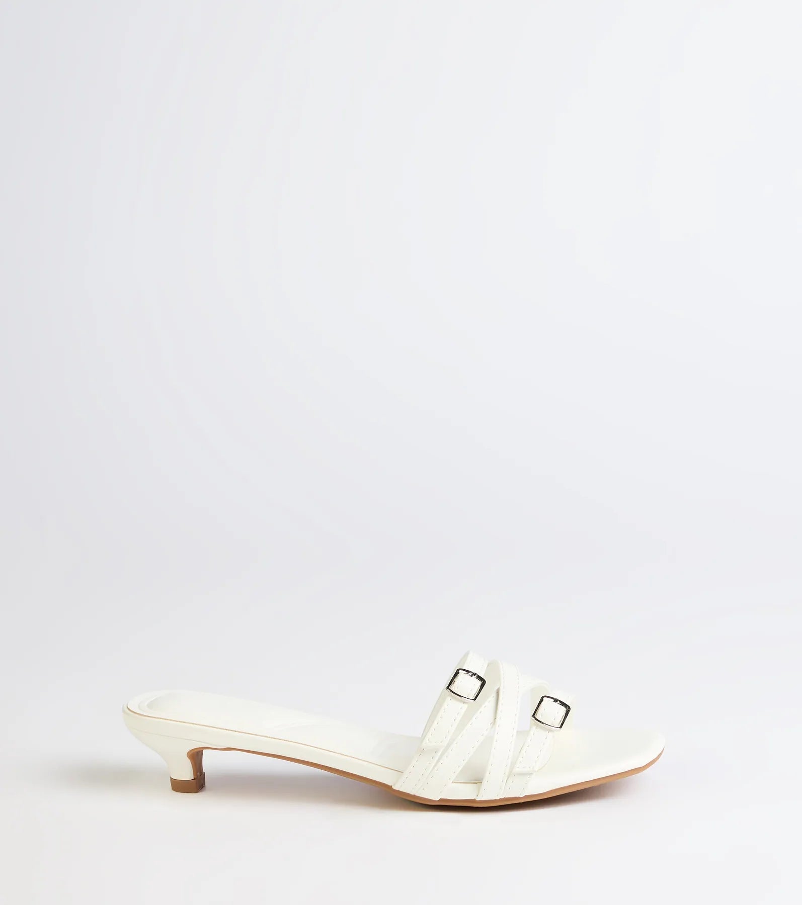 Turn heads in the Trendy Steps Buckle Strap Kitten Heel Mules, white heels showcasing a fresh trend or stylish detail made to elevate your full Windsor fit.