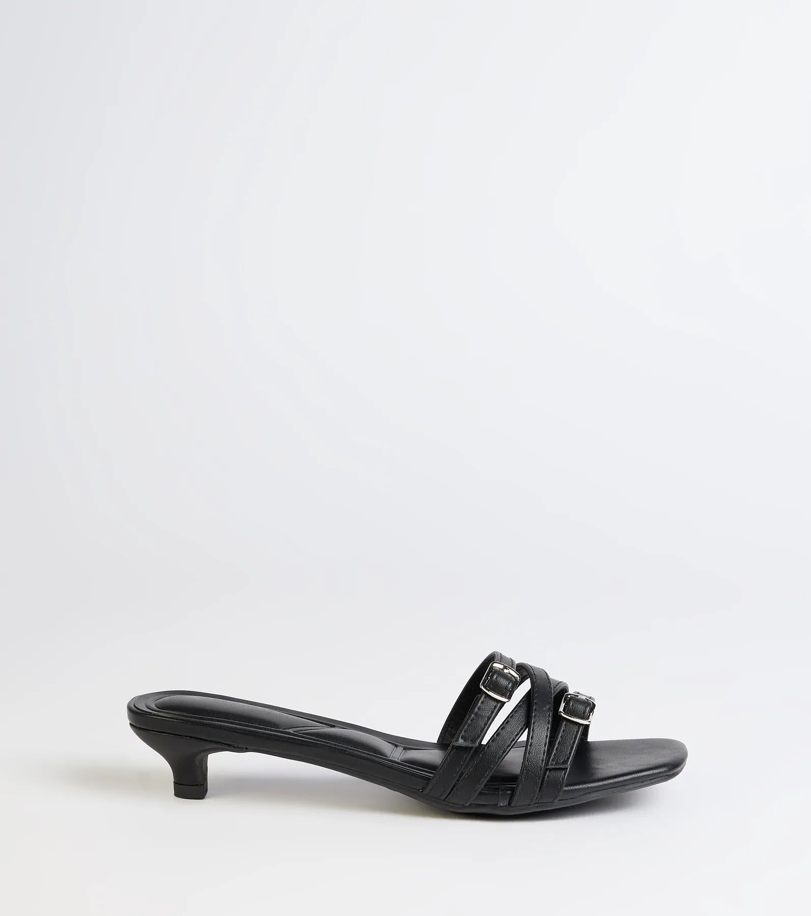 Turn heads in the Trendy Steps Buckle Strap Kitten Heel Mules, black heels showcasing a fresh trend or stylish detail made to elevate your full Windsor fit.