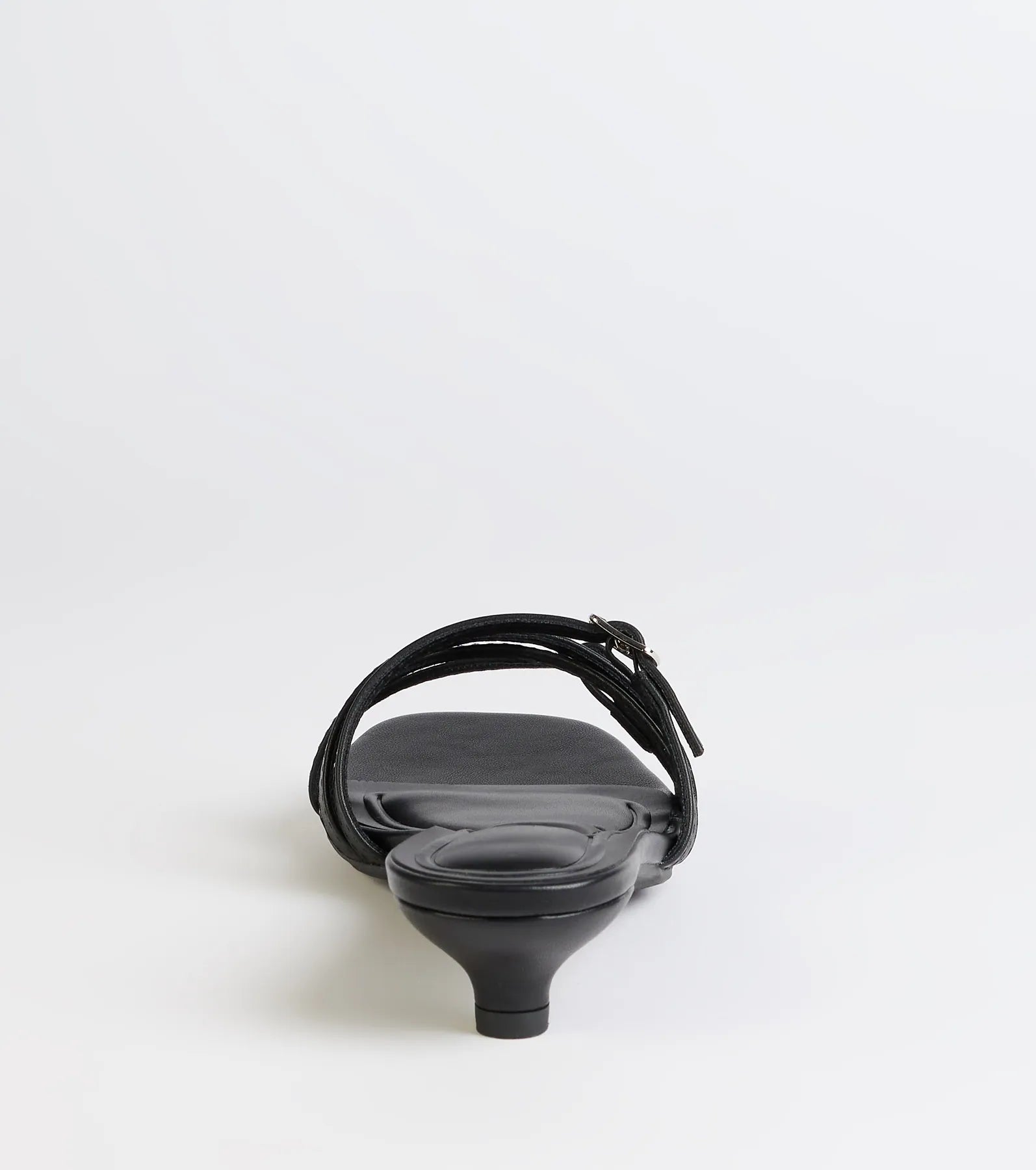 Turn heads in the Trendy Steps Buckle Strap Kitten Heel Mules, black heels showcasing a fresh trend or stylish detail made to elevate your full Windsor fit.