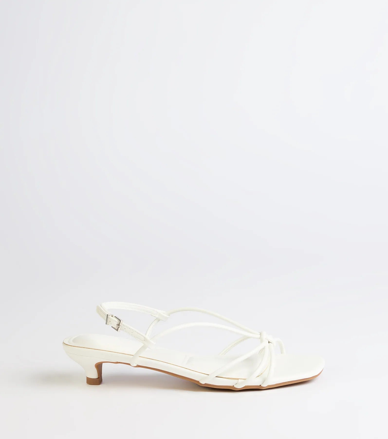 Turn heads in the Tied Together Strappy Kitten Heels, white heels showcasing a fresh trend or stylish detail made to elevate your full Windsor fit.