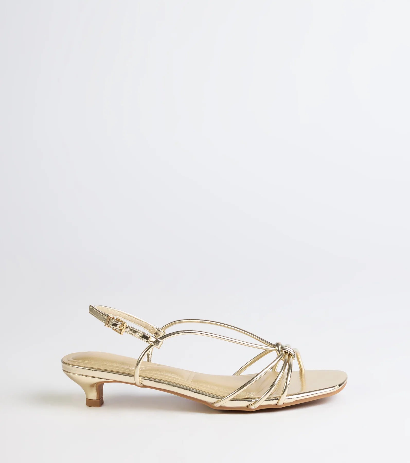 Turn heads in the Tied Together Strappy Kitten Heels, gold heels showcasing a fresh trend or stylish detail made to elevate your full Windsor fit.
