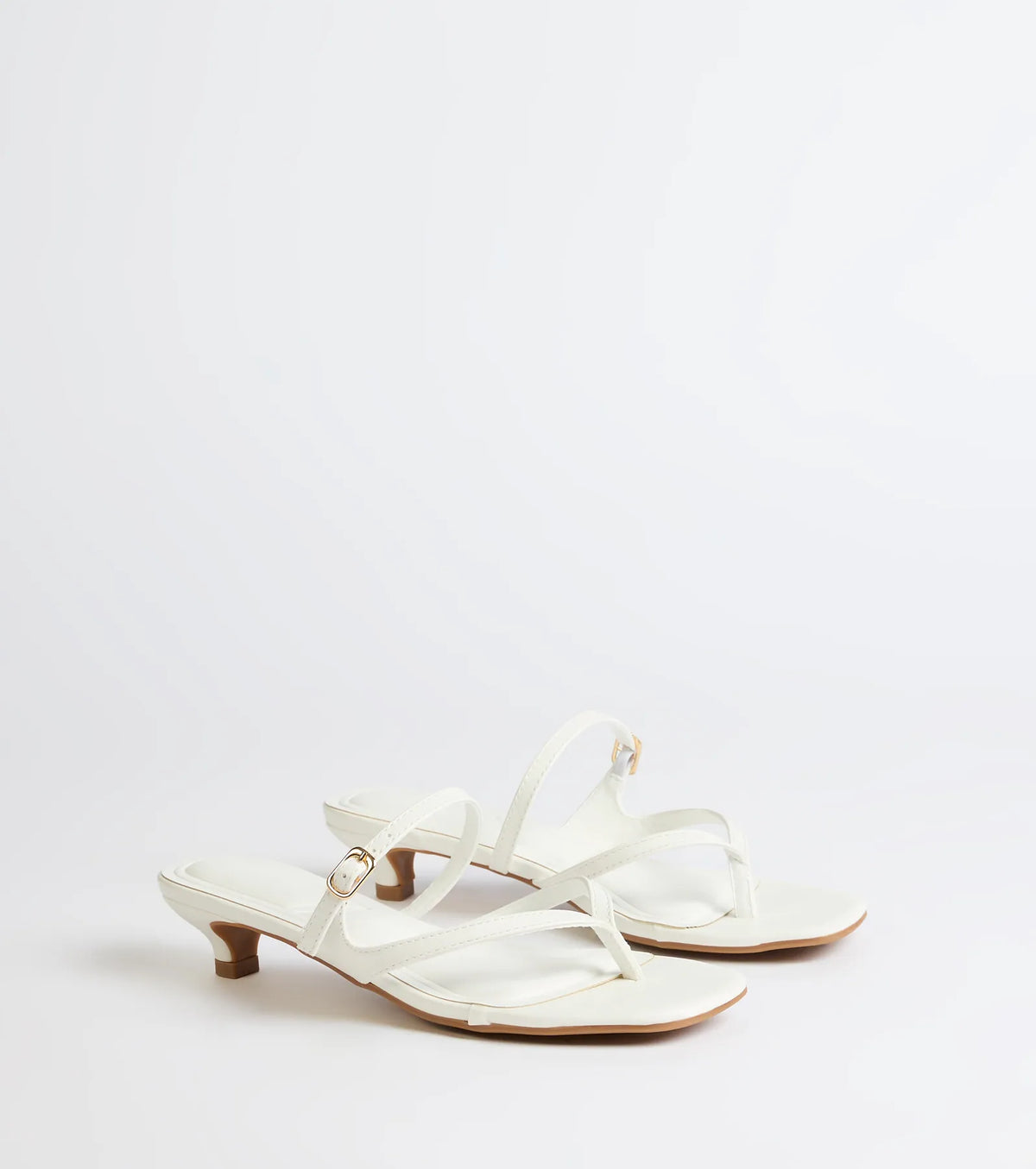 Style made simple with the Chic Trend Thong Strap Kitten Heel Mules in white, trendy women’s shoes that take your outfit from basic to bold in one step.