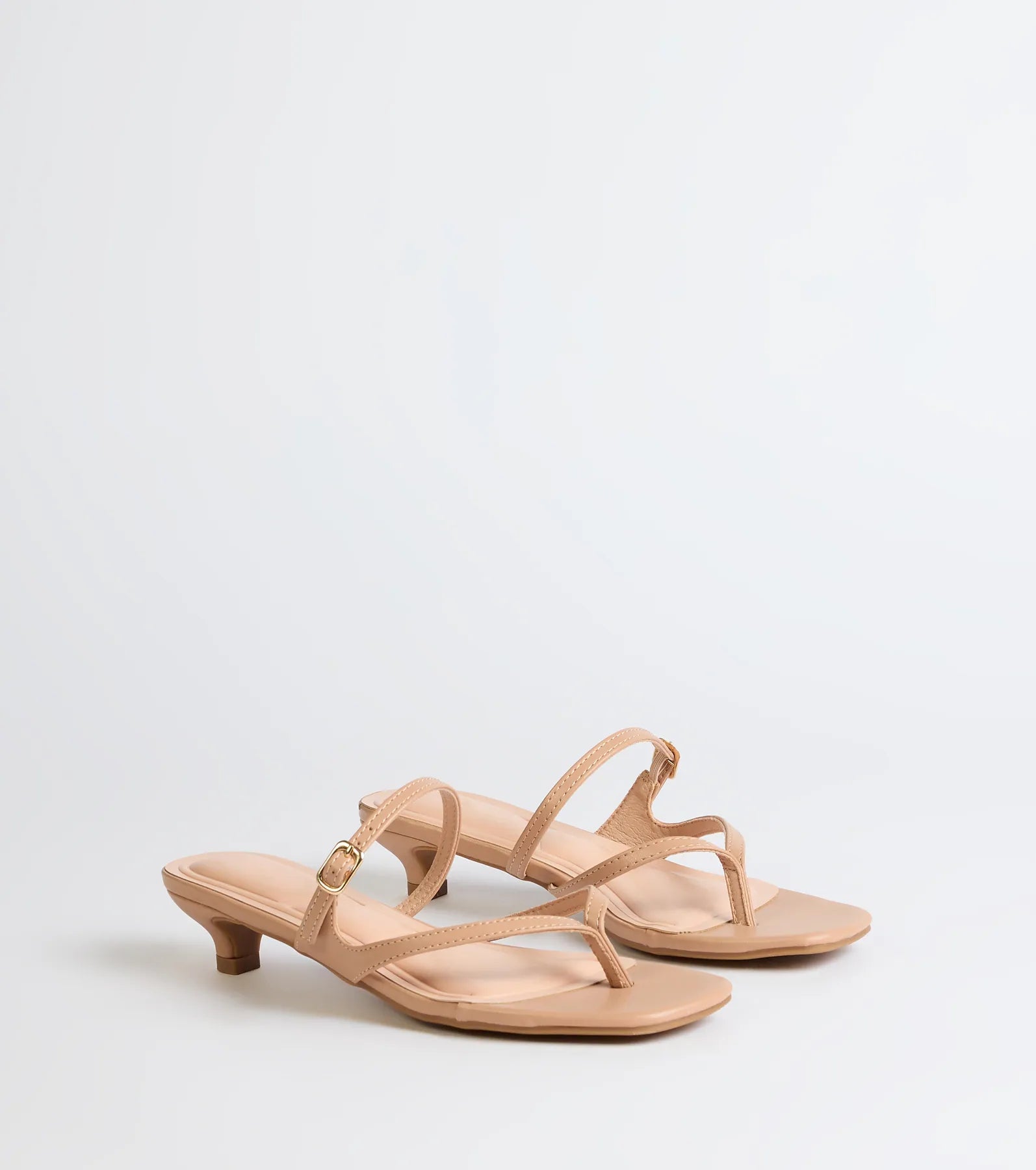 Style made simple with the Chic Trend Thong Strap Kitten Heel Mules in nude, trendy women’s shoes that take your outfit from basic to bold in one step.