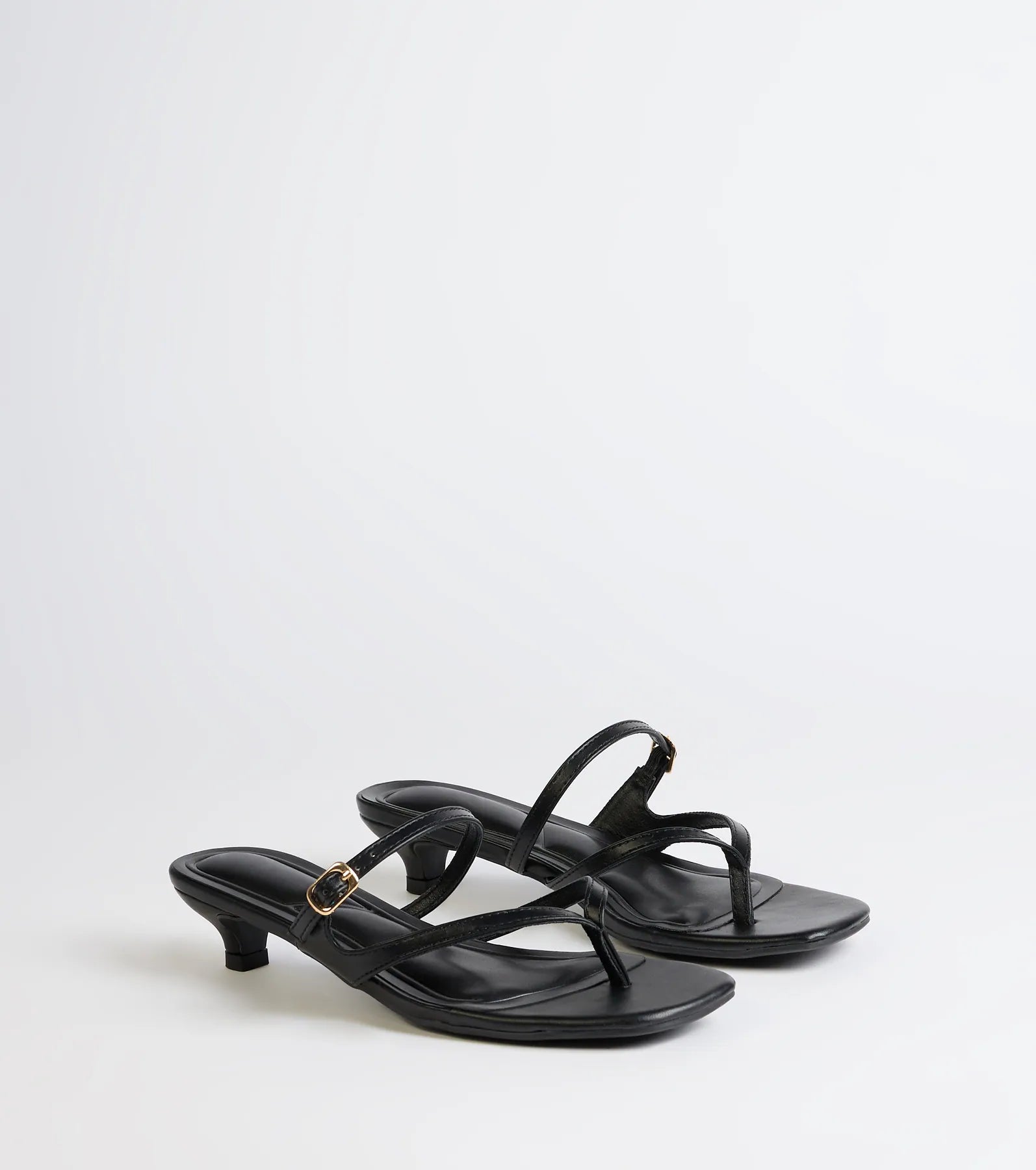 Style made simple with the Chic Trend Thong Strap Kitten Heel Mules in black, trendy women’s shoes that take your outfit from basic to bold in one step.