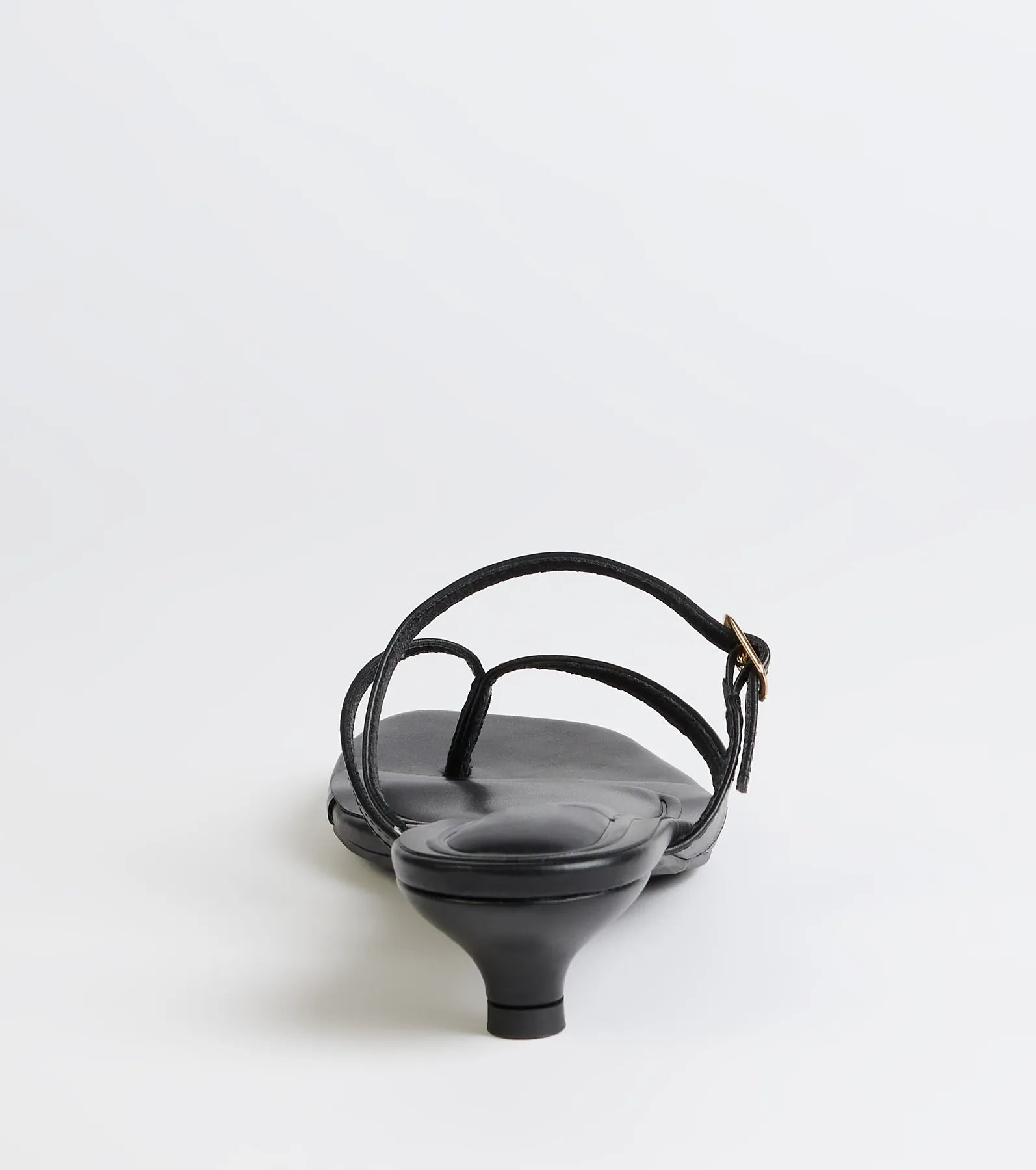 Elevate warm-weather looks with Chic Trend Thong Strap Kitten Heel Mules in black, a pair of trendy sandals bringing chic, modern flair to every step.