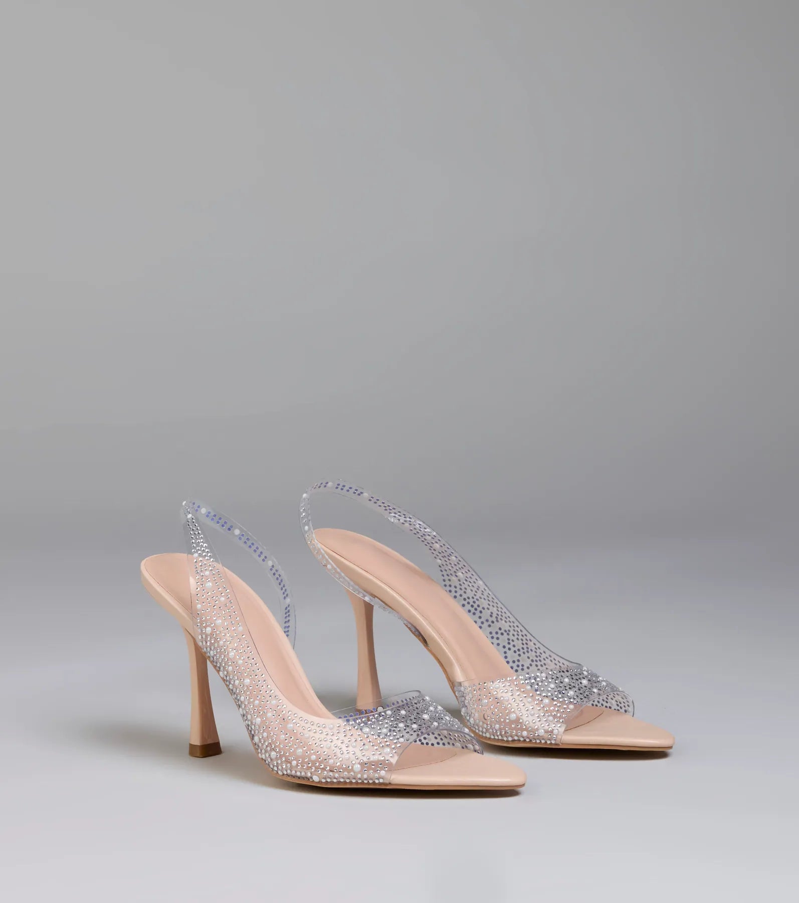 Step into style with the Clear Goals Rhinestone Pearl Slingback Pumps, clear heels made to complete your Windsor look with comfort and glam in mind.
