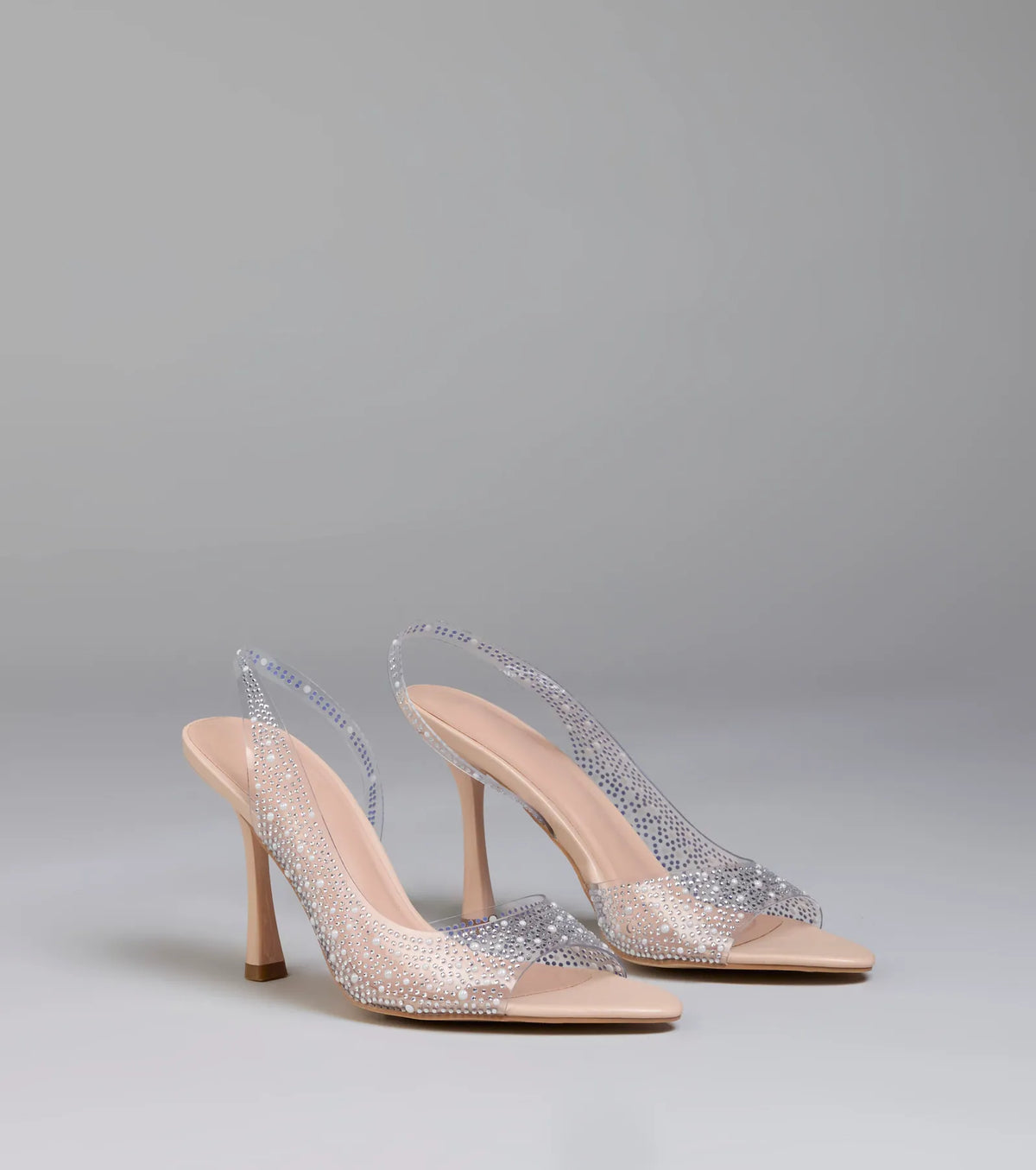 Step into style with the Clear Goals Rhinestone Pearl Slingback Pumps, clear heels made to complete your Windsor look with comfort and glam in mind.