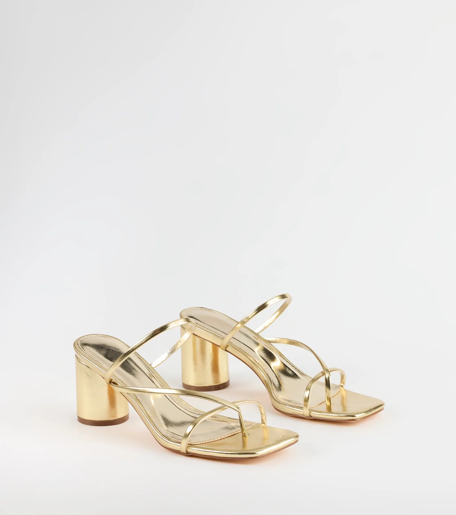 Style made simple with the So Much Personality Strappy Block Heels in gold, trendy women’s shoes that take your outfit from basic to bold in one step.