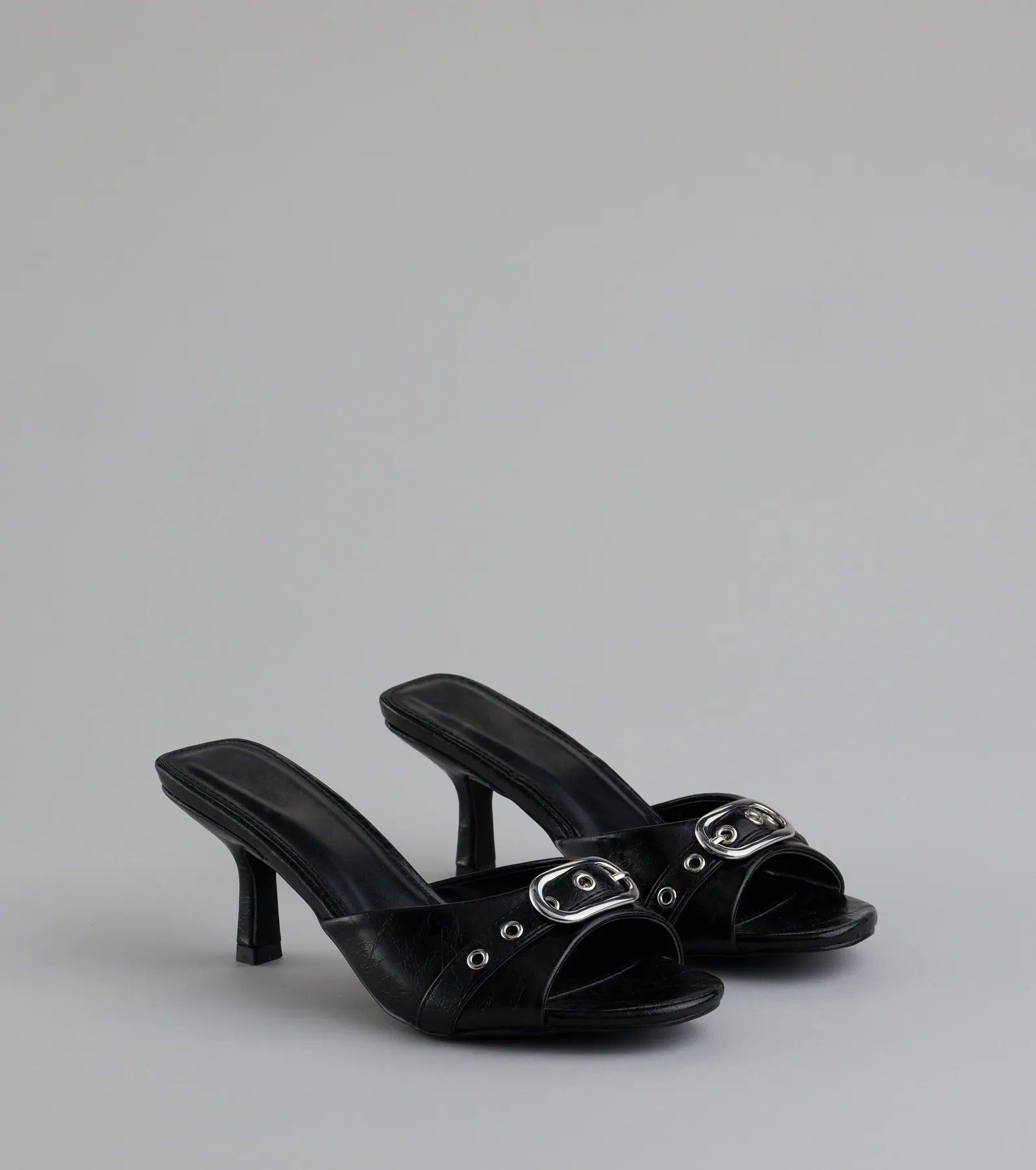 Style made simple with the Brunch To Cocktails Buckle Stiletto Mules in black, trendy women’s shoes that take your outfit from basic to bold in one step.