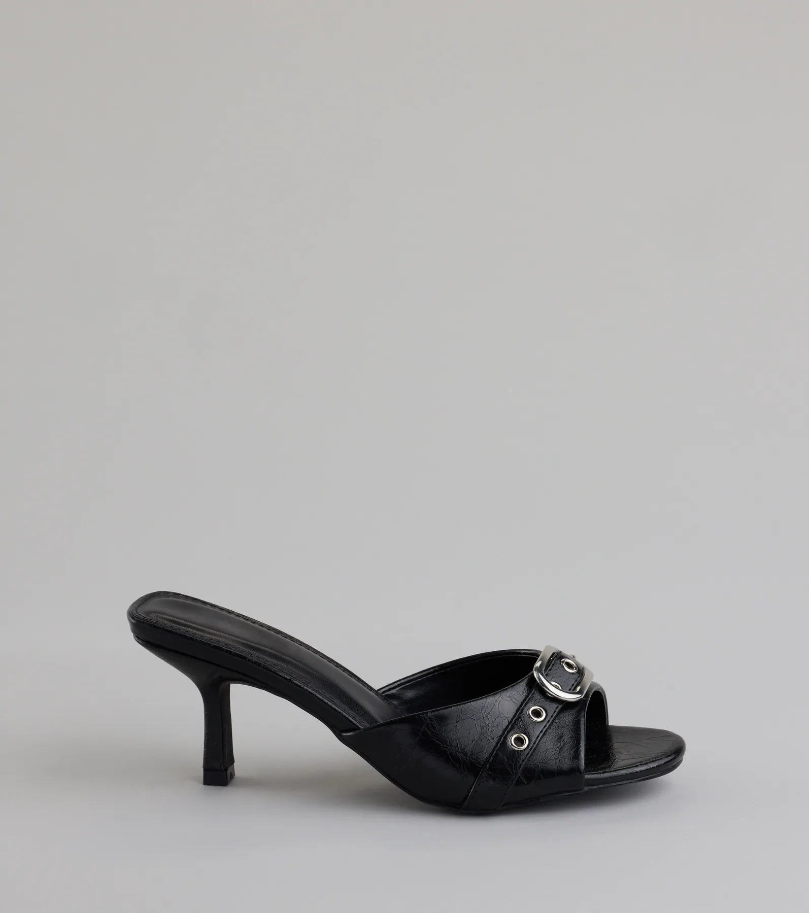Elevate warm-weather looks with Brunch To Cocktails Buckle Stiletto Mules in black, a pair of trendy sandals bringing chic, modern flair to every step.