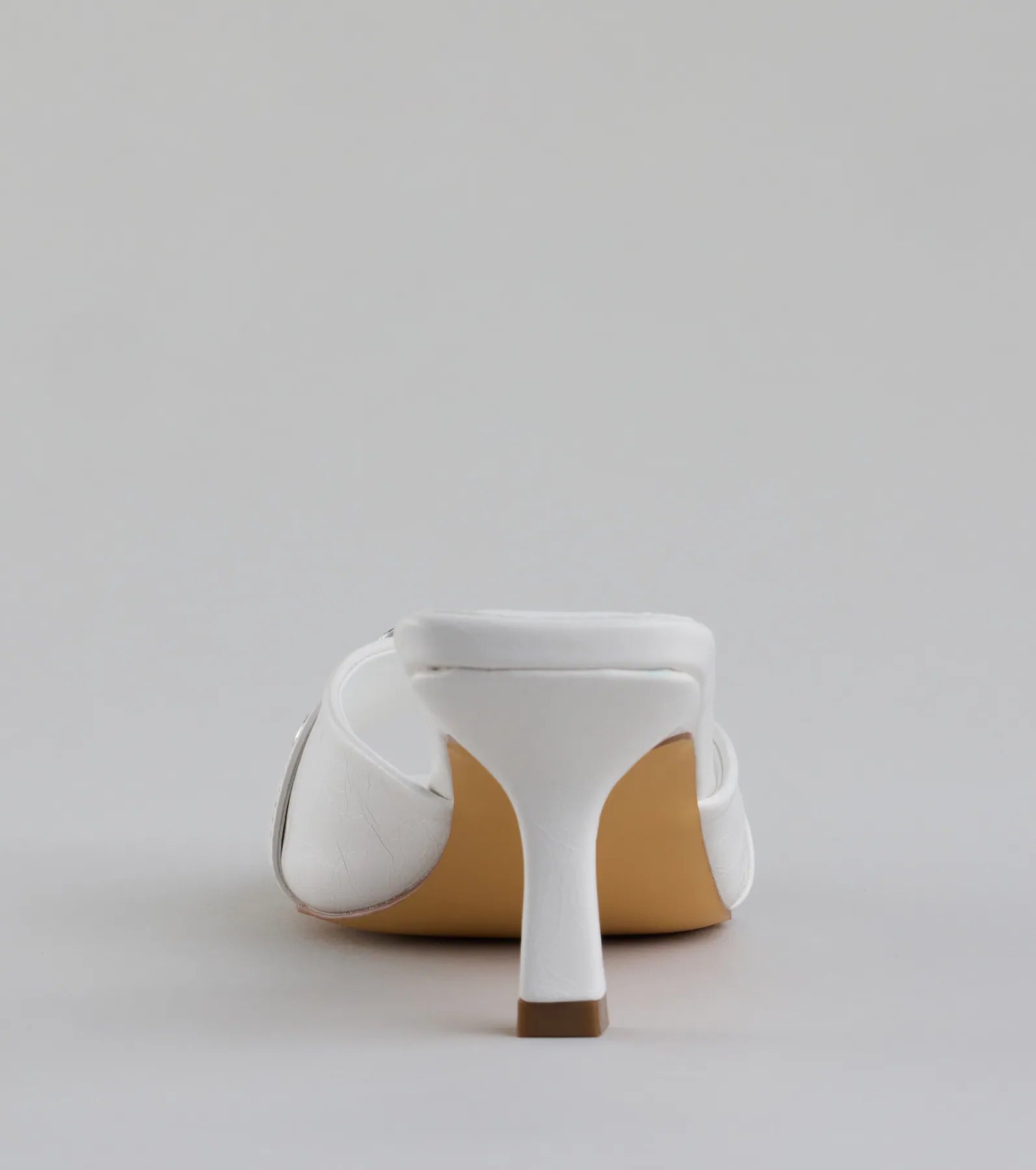 Elevate warm-weather looks with Brunch To Cocktails Buckle Stiletto Mules in white, a pair of trendy sandals bringing chic, modern flair to every step.