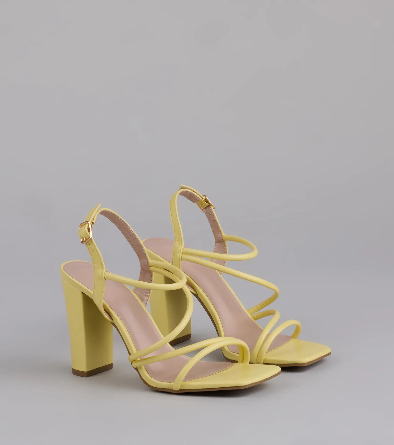 Style made simple with the Flirt Mode Activated Strappy Block Heels in yellow, trendy women’s shoes that take your outfit from basic to bold in one step.
