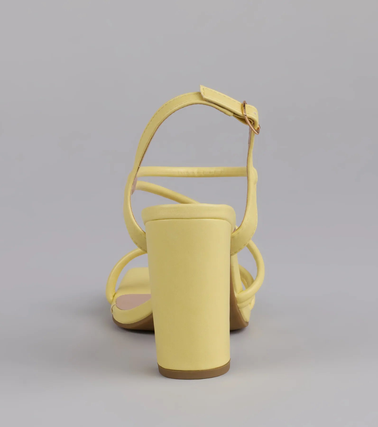 Style made simple with the Flirt Mode Activated Strappy Block Heels in yellow, trendy women’s shoes that take your outfit from basic to bold in one step.