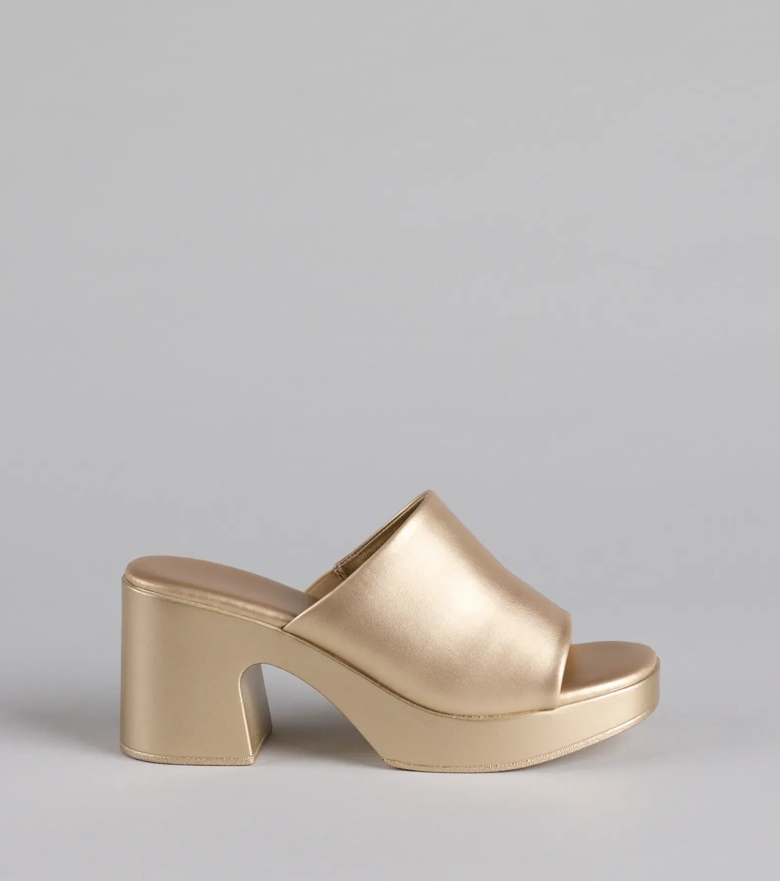 Elevate warm-weather looks with 90s Icon Platform Block Heel Mules in gold, a pair of trendy sandals bringing chic, modern flair to every step.