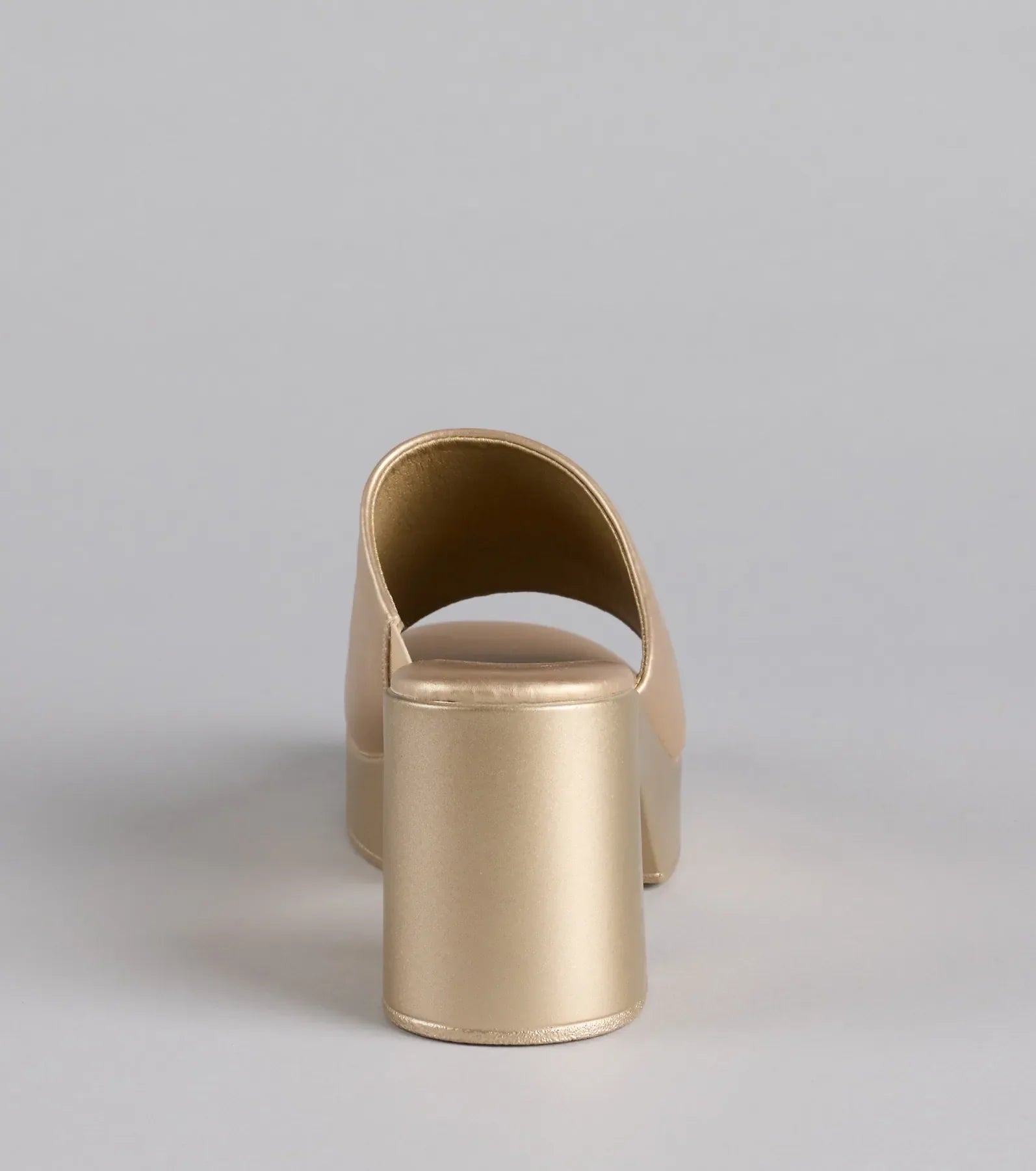 Elevate warm-weather looks with 90s Icon Platform Block Heel Mules in gold, a pair of trendy sandals bringing chic, modern flair to every step.