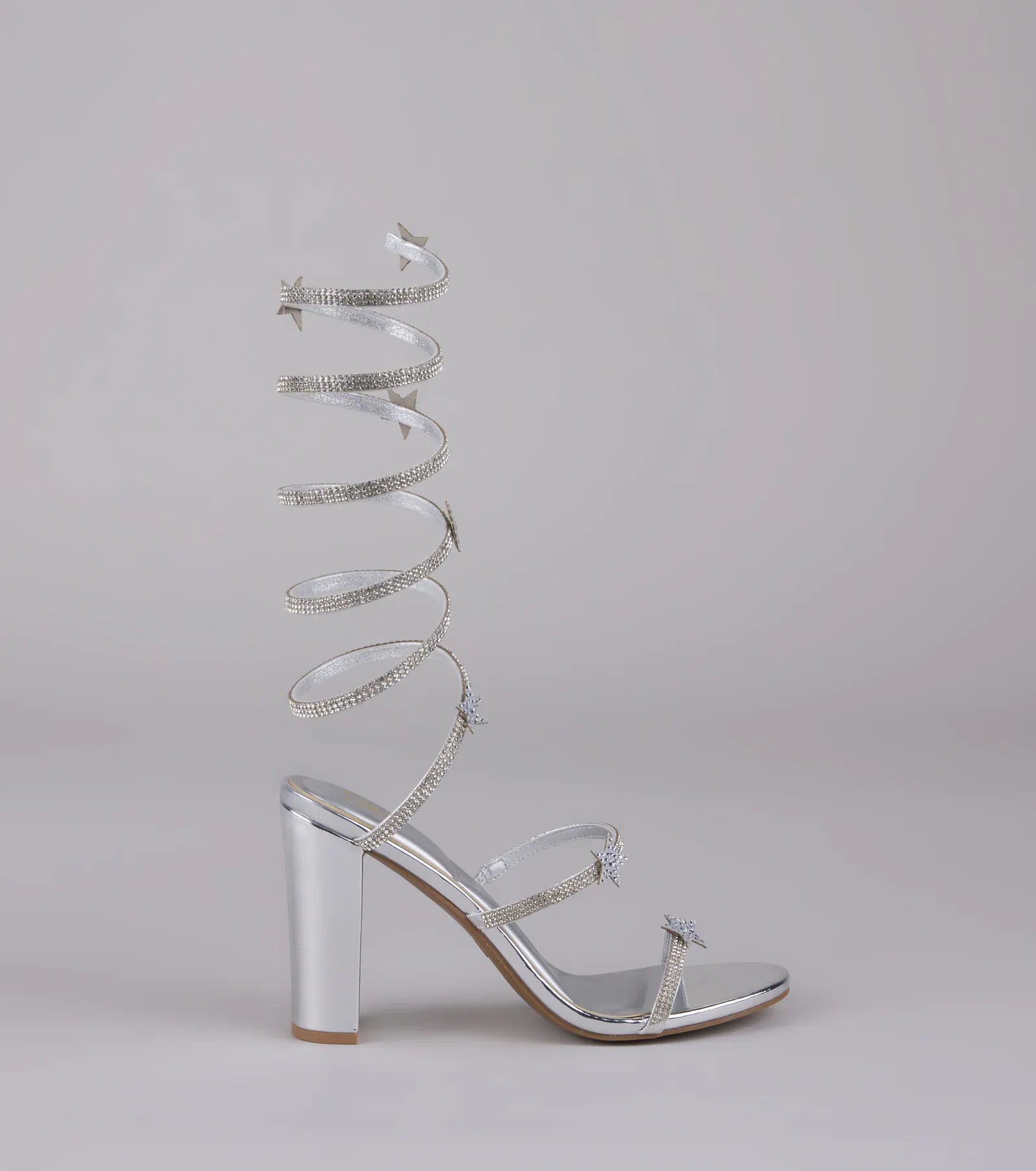 Style made simple with the Catch Me in the Cosmos Star Spiral Heels in silver, trendy women’s shoes that take your outfit from basic to bold in one step.