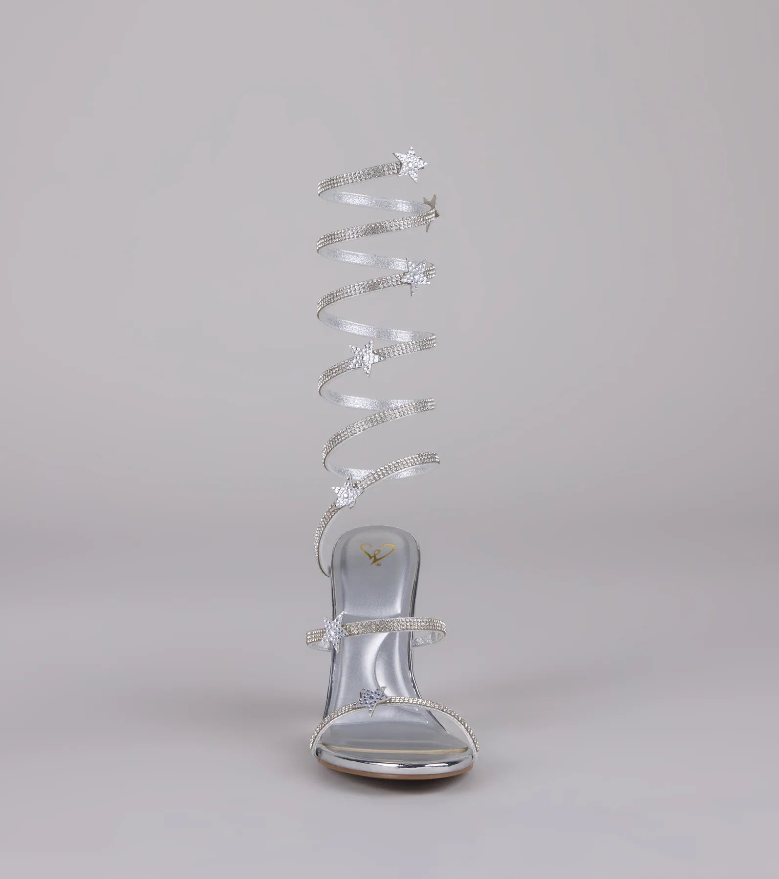 Style made simple with the Catch Me in the Cosmos Star Spiral Heels in silver, trendy women’s shoes that take your outfit from basic to bold in one step.