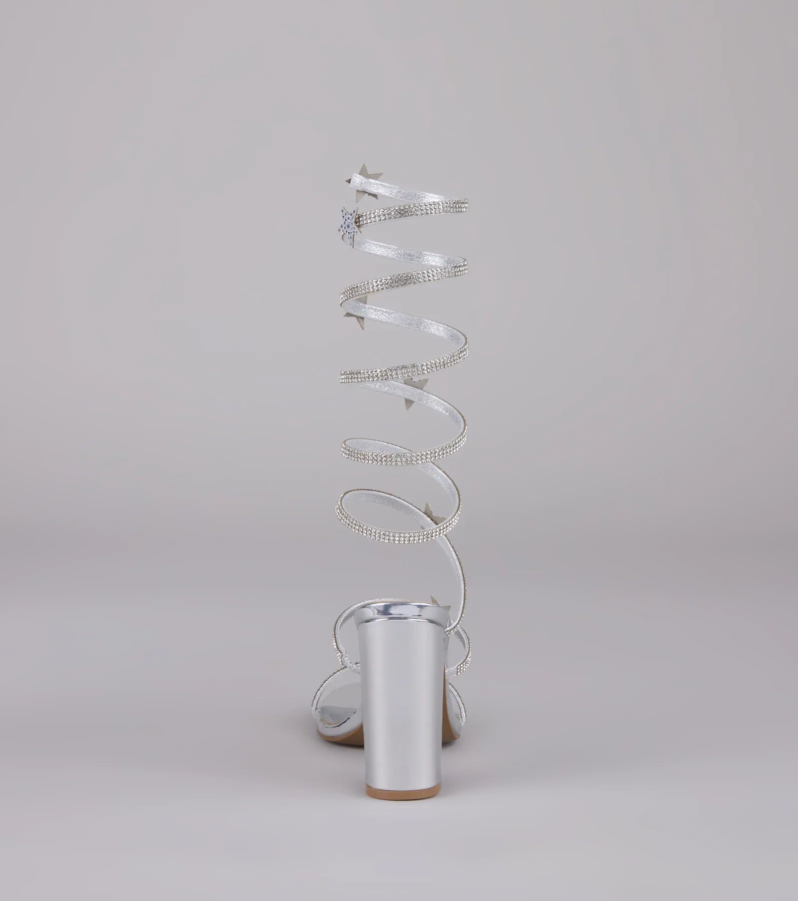 Style made simple with the Catch Me in the Cosmos Star Spiral Heels in silver, trendy women’s shoes that take your outfit from basic to bold in one step.