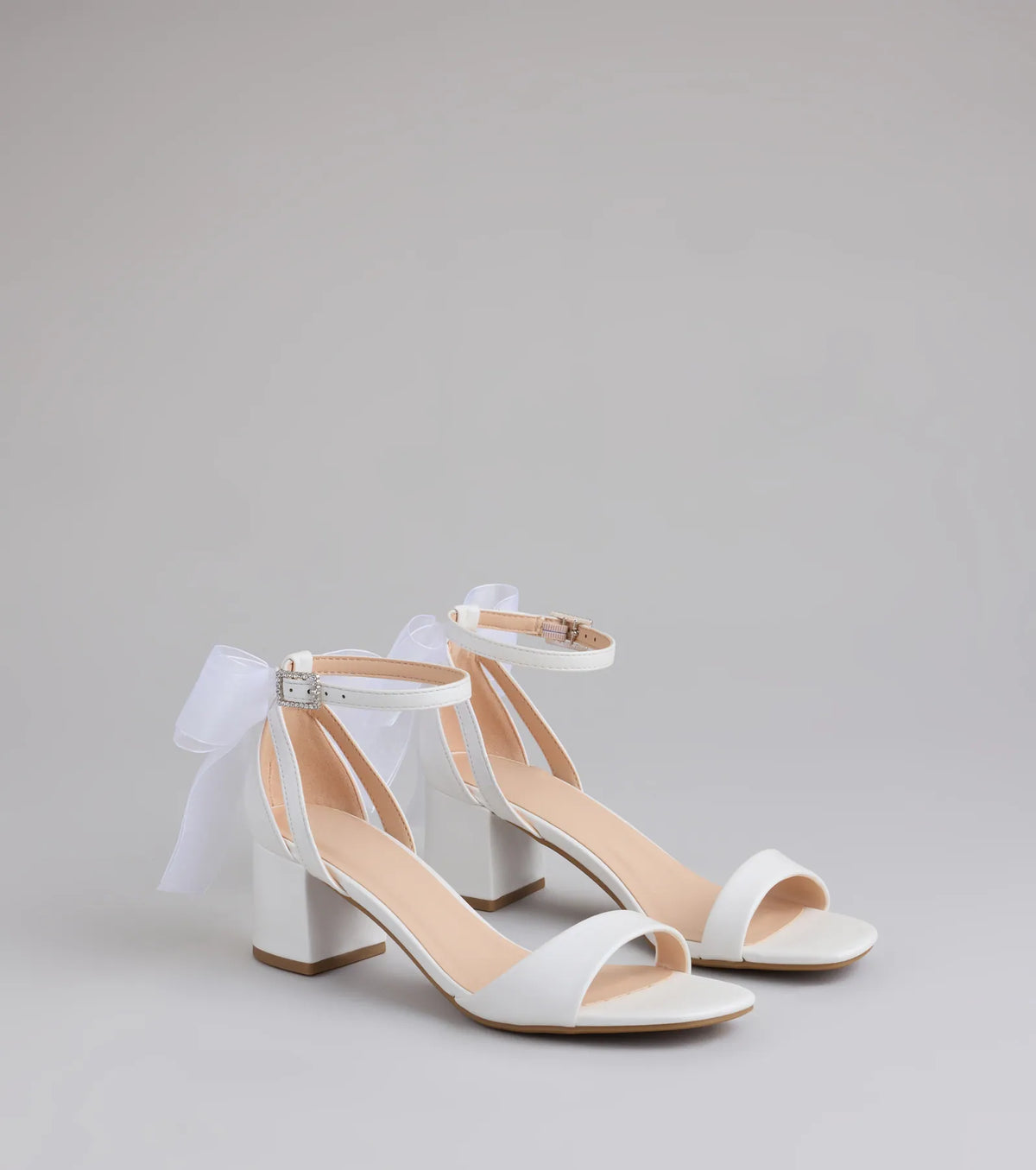 Step into style with the So Pretty Chiffon Bow Satin Block Heels, white heels made to complete your Windsor look with comfort and glam in mind.