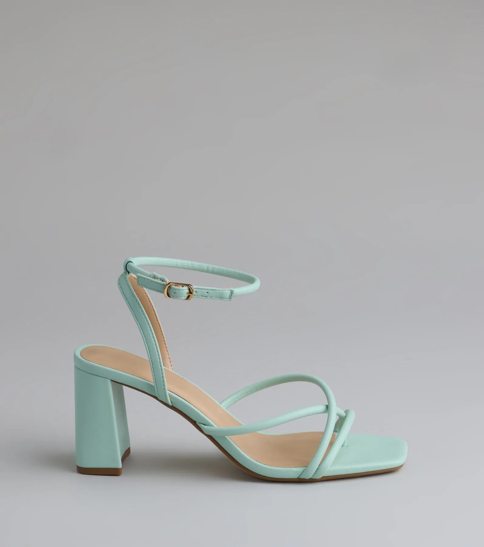 Elevate warm-weather looks with Chic Favorite Strappy Block Heels in mint green, a pair of trendy sandals bringing chic, modern flair to every step.