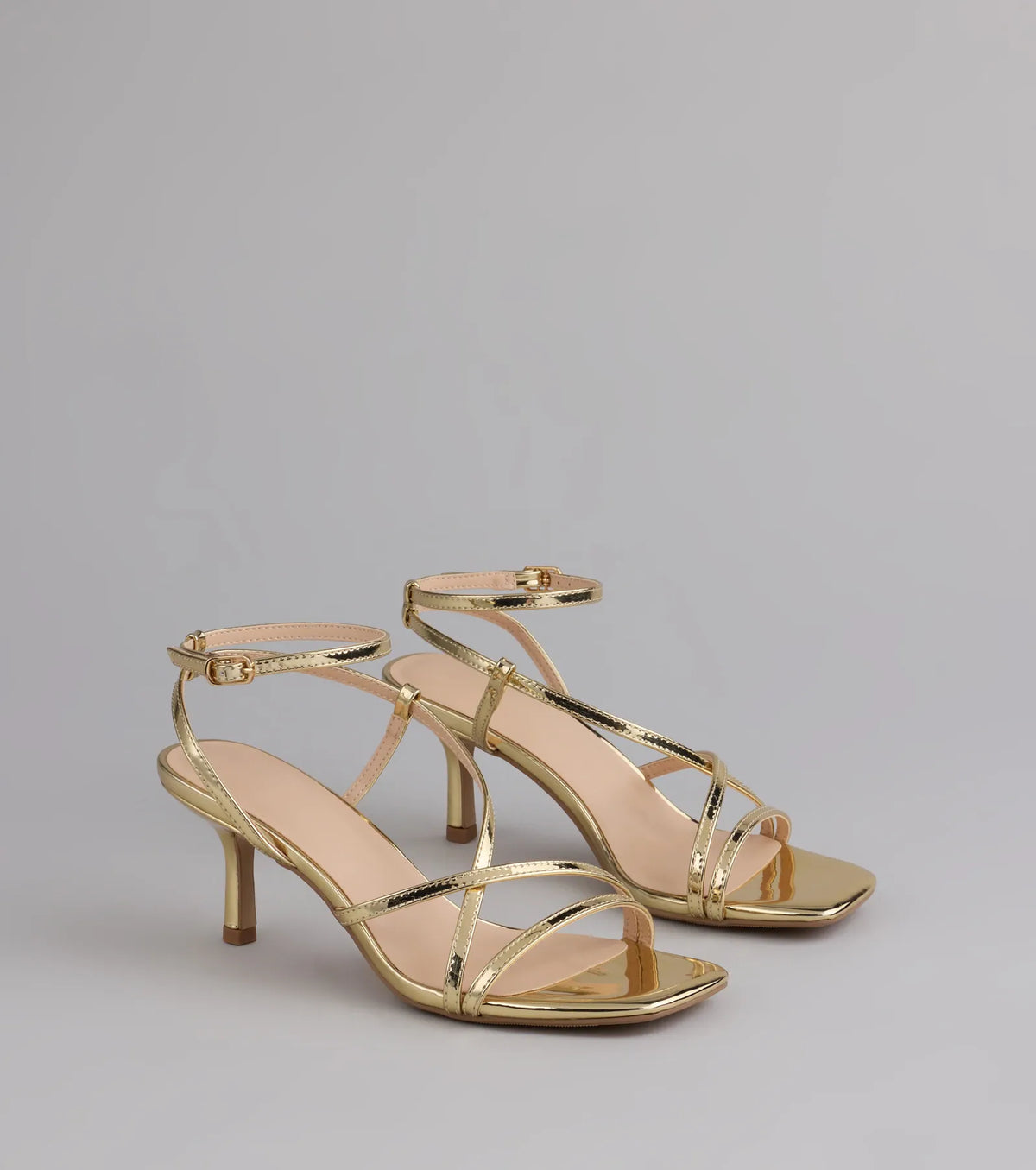 Style made simple with the Simply Stunning Strappy Kitten Heels in gold, trendy women’s shoes that take your outfit from basic to bold in one step.