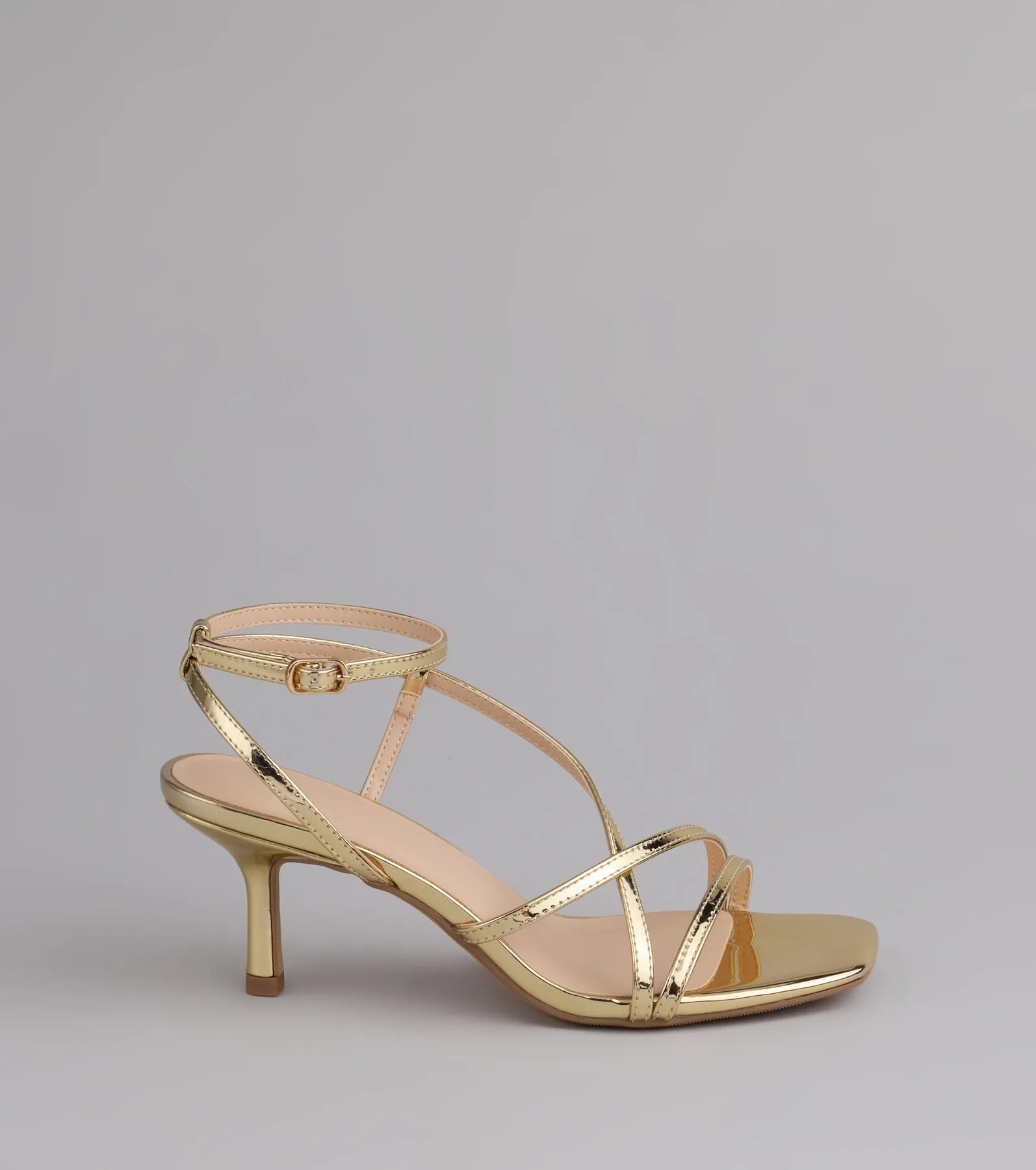 Style made simple with the Simply Stunning Strappy Kitten Heels in gold, trendy women’s shoes that take your outfit from basic to bold in one step.