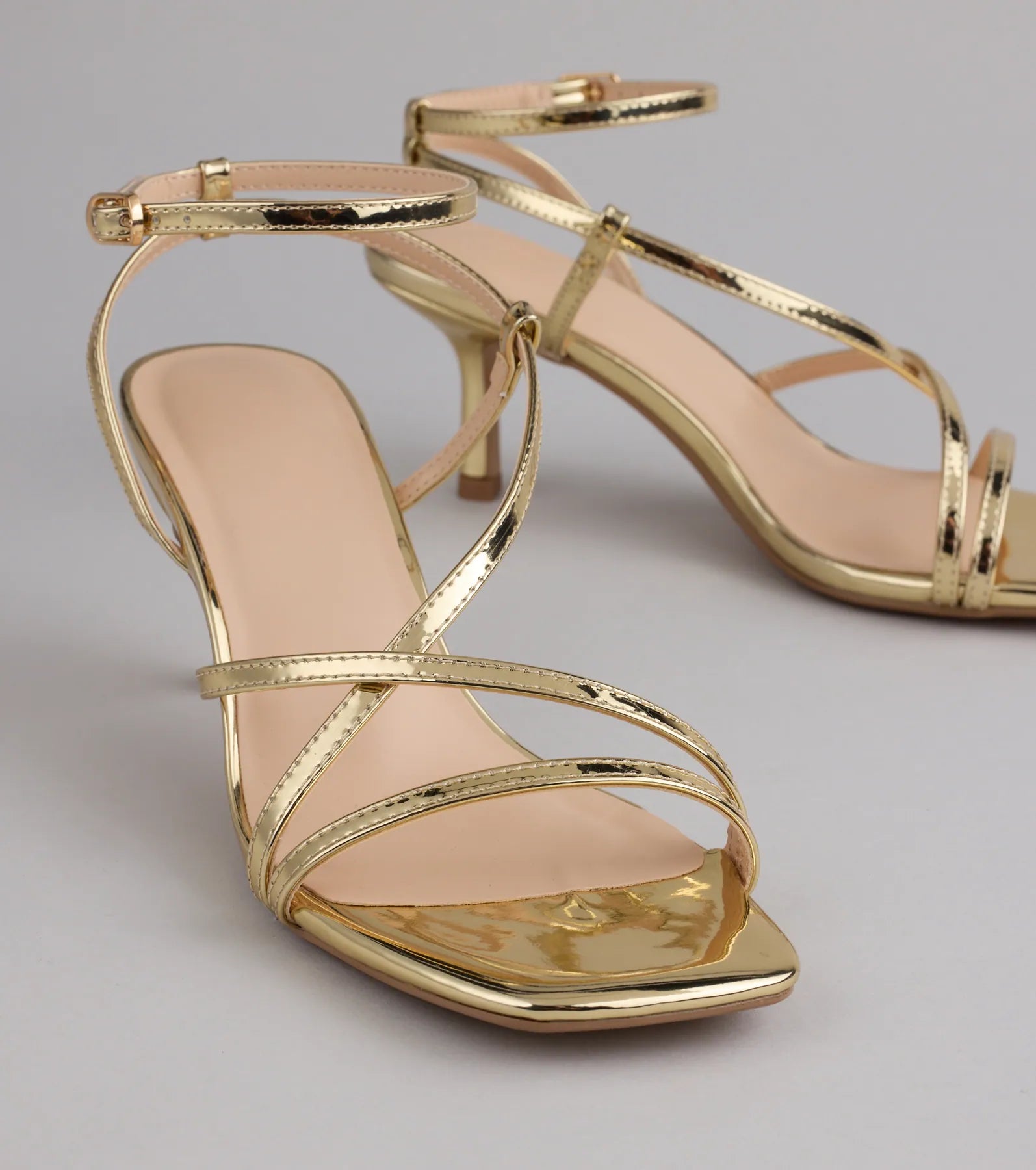 Style made simple with the Simply Stunning Strappy Kitten Heels in gold, trendy women’s shoes that take your outfit from basic to bold in one step.