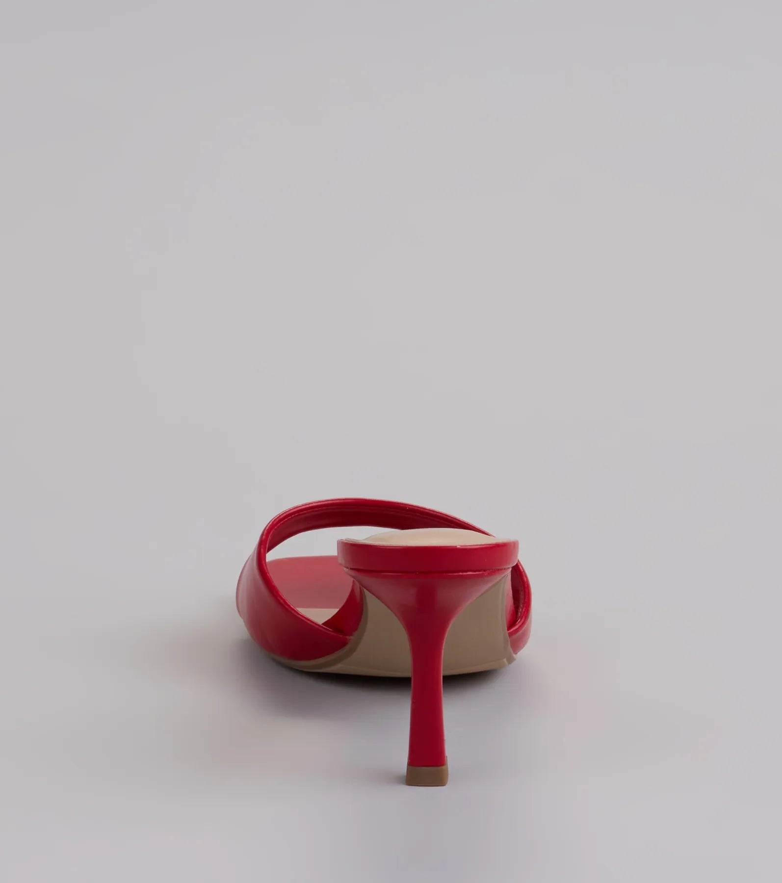 Elevate warm-weather looks with Glam Stunner Stiletto Mules in red, a pair of trendy sandals bringing chic, modern flair to every step.