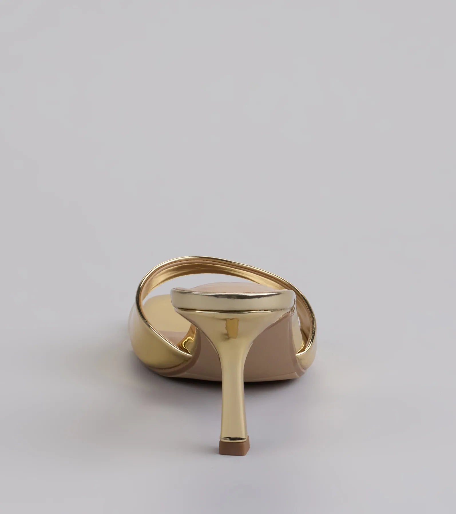 Elevate warm-weather looks with Glam Stunner Stiletto Mules in gold, a pair of trendy sandals bringing chic, modern flair to every step.