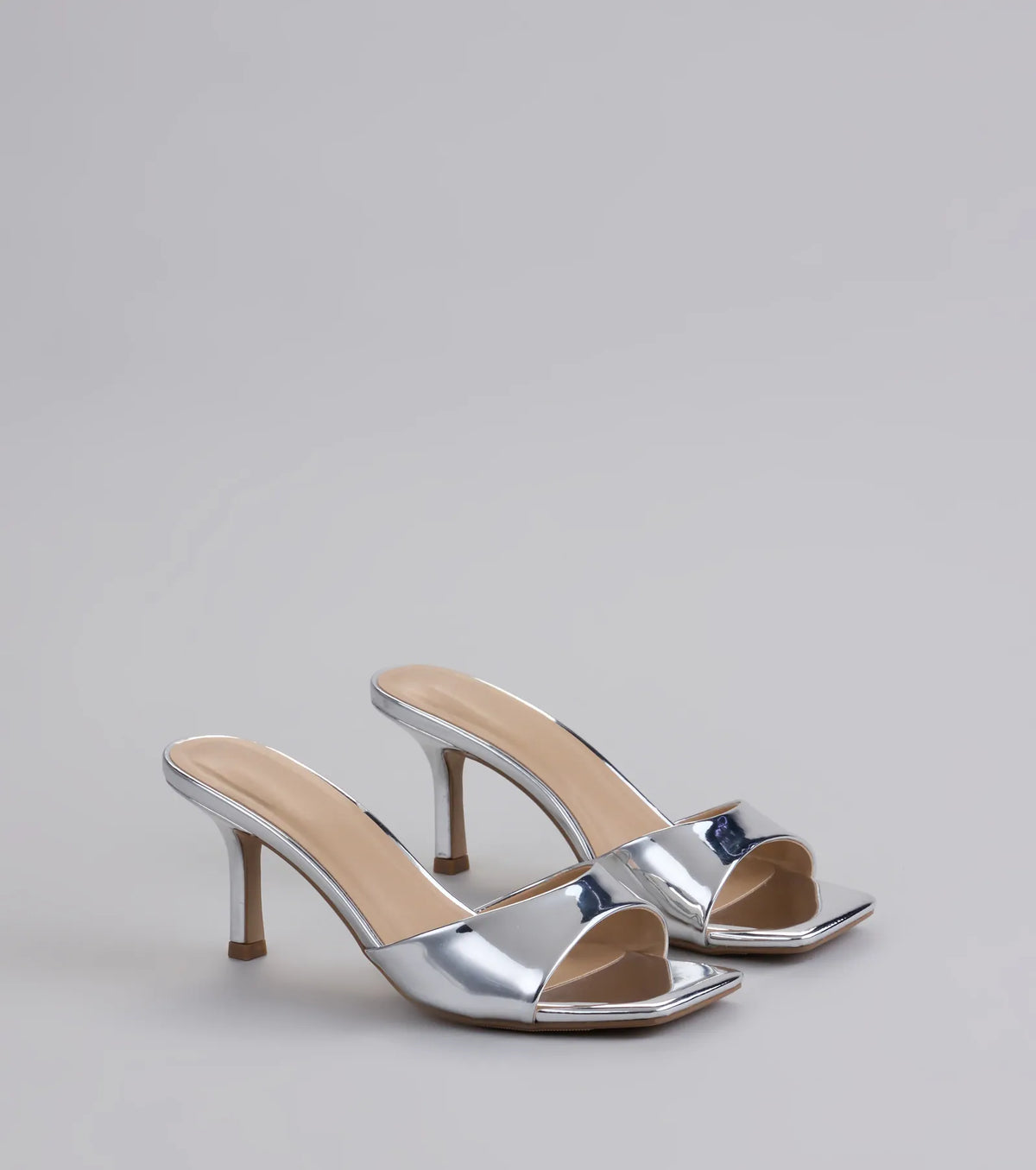 Style made simple with the Glam Stunner Stiletto Mules in silver, trendy women’s shoes that take your outfit from basic to bold in one step.