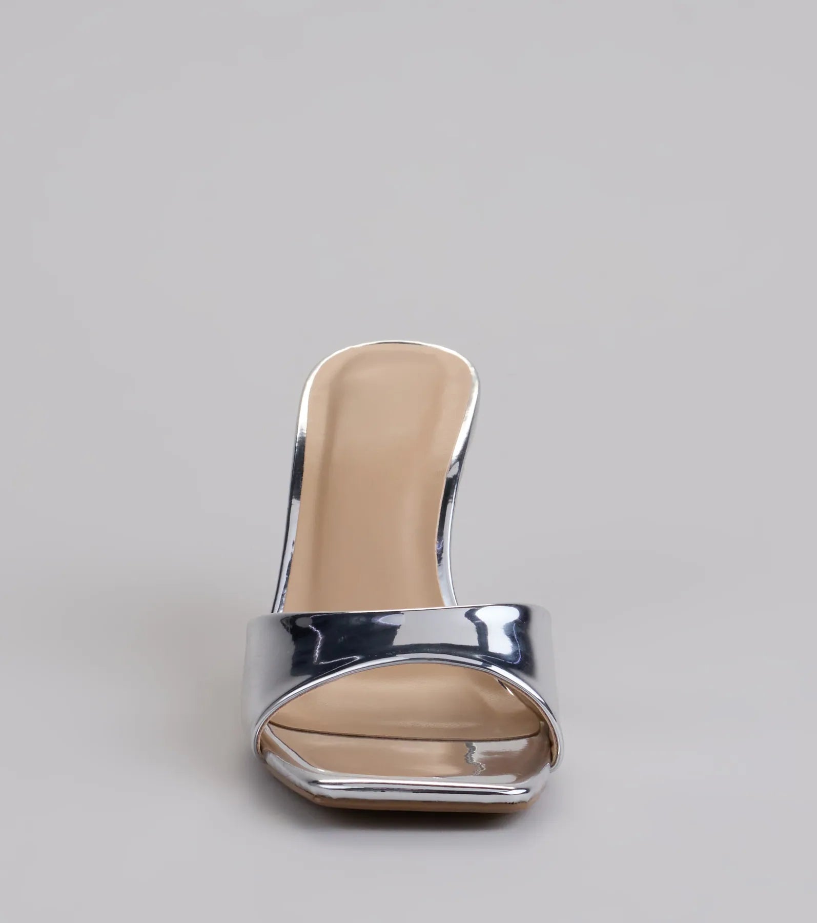 Elevate warm-weather looks with Glam Stunner Stiletto Mules in silver, a pair of trendy sandals bringing chic, modern flair to every step.